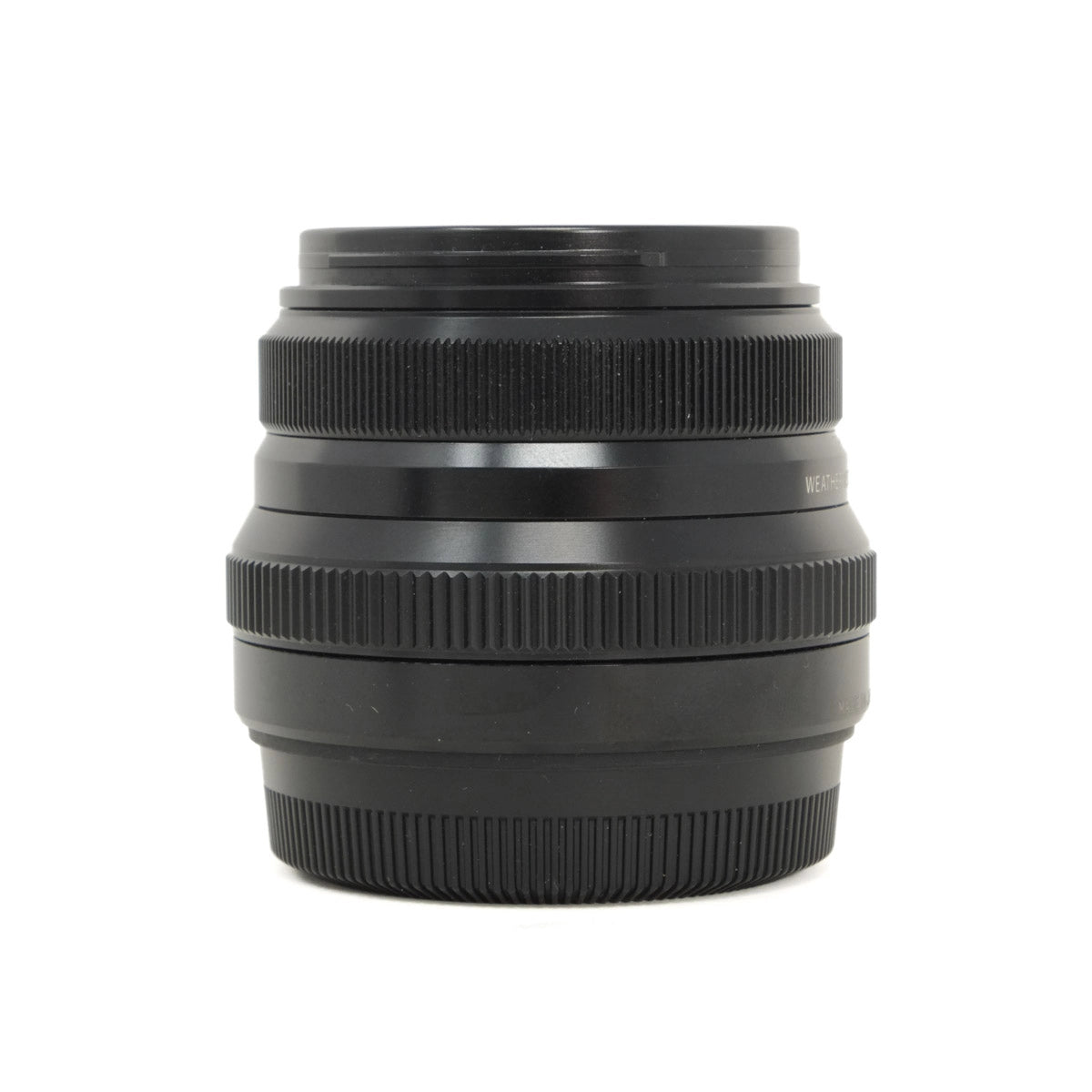 Black camera lens on a white background