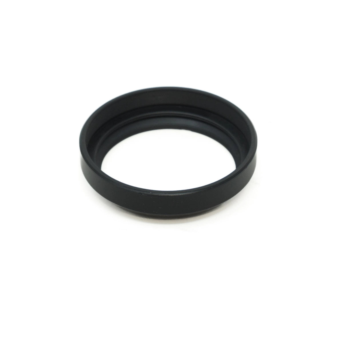 Black lens hood on a white background