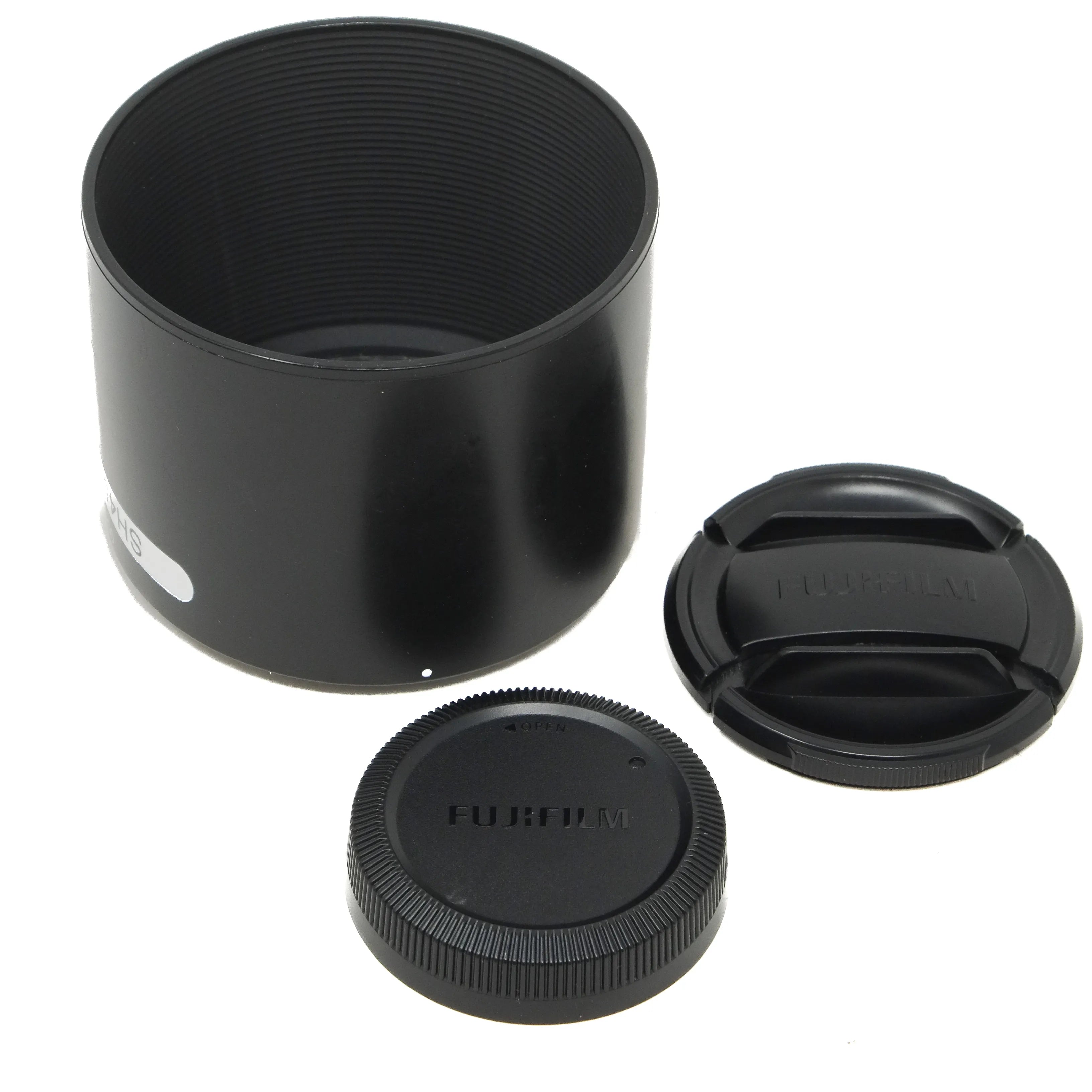 Set of black camera lens components on a white background