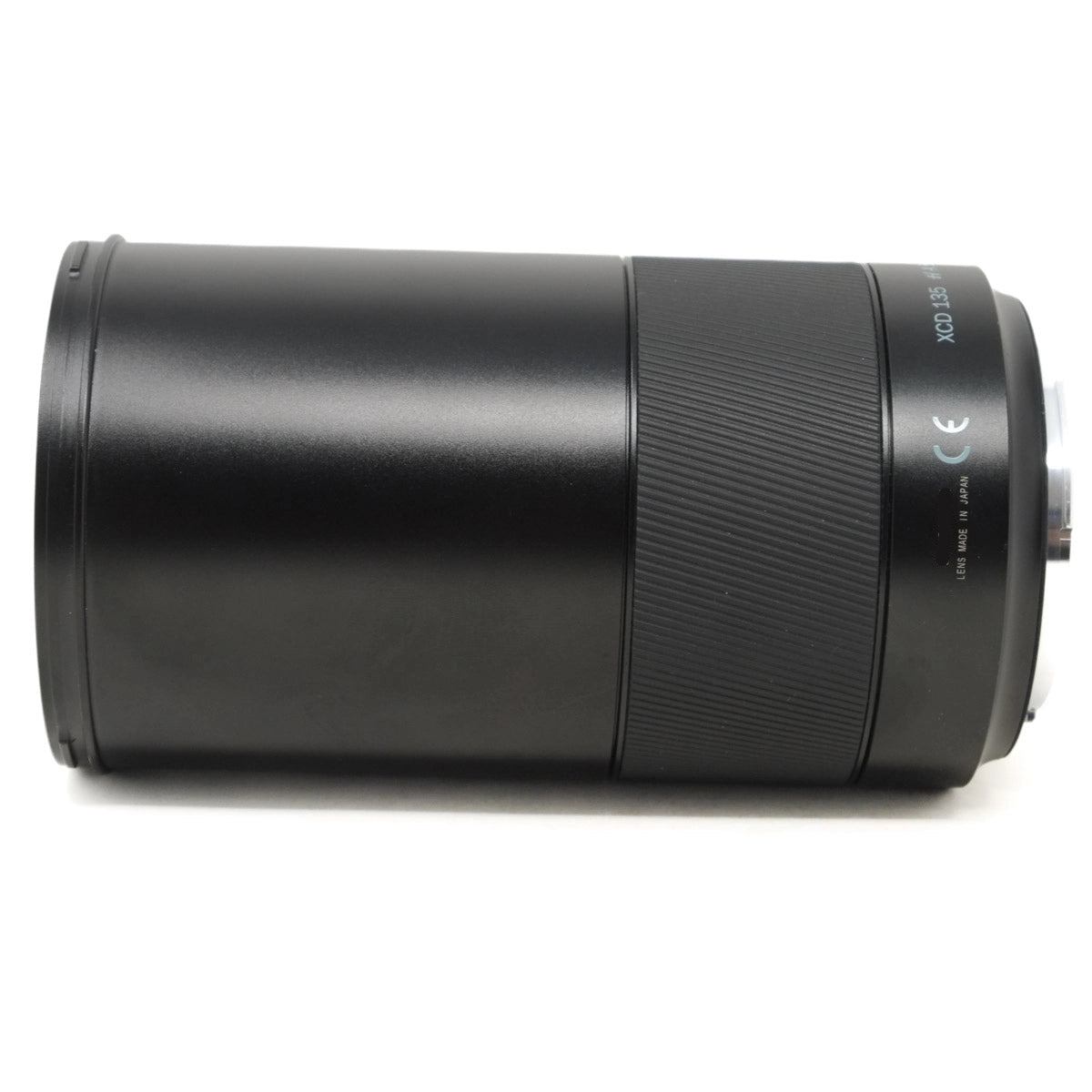 Black camera lens on a white background