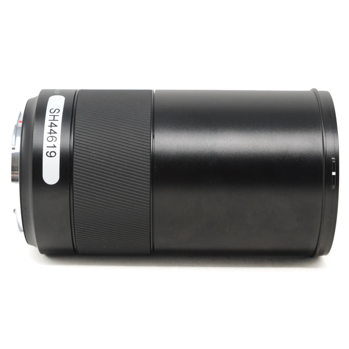 Black cylindrical lens with a visible brand label on a white background
