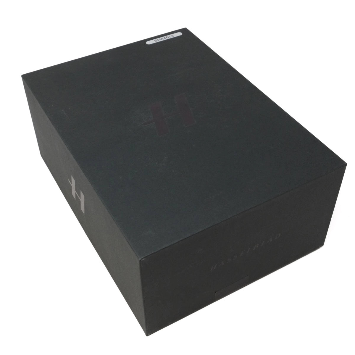 Black rectangular box with a brand logo on a white background