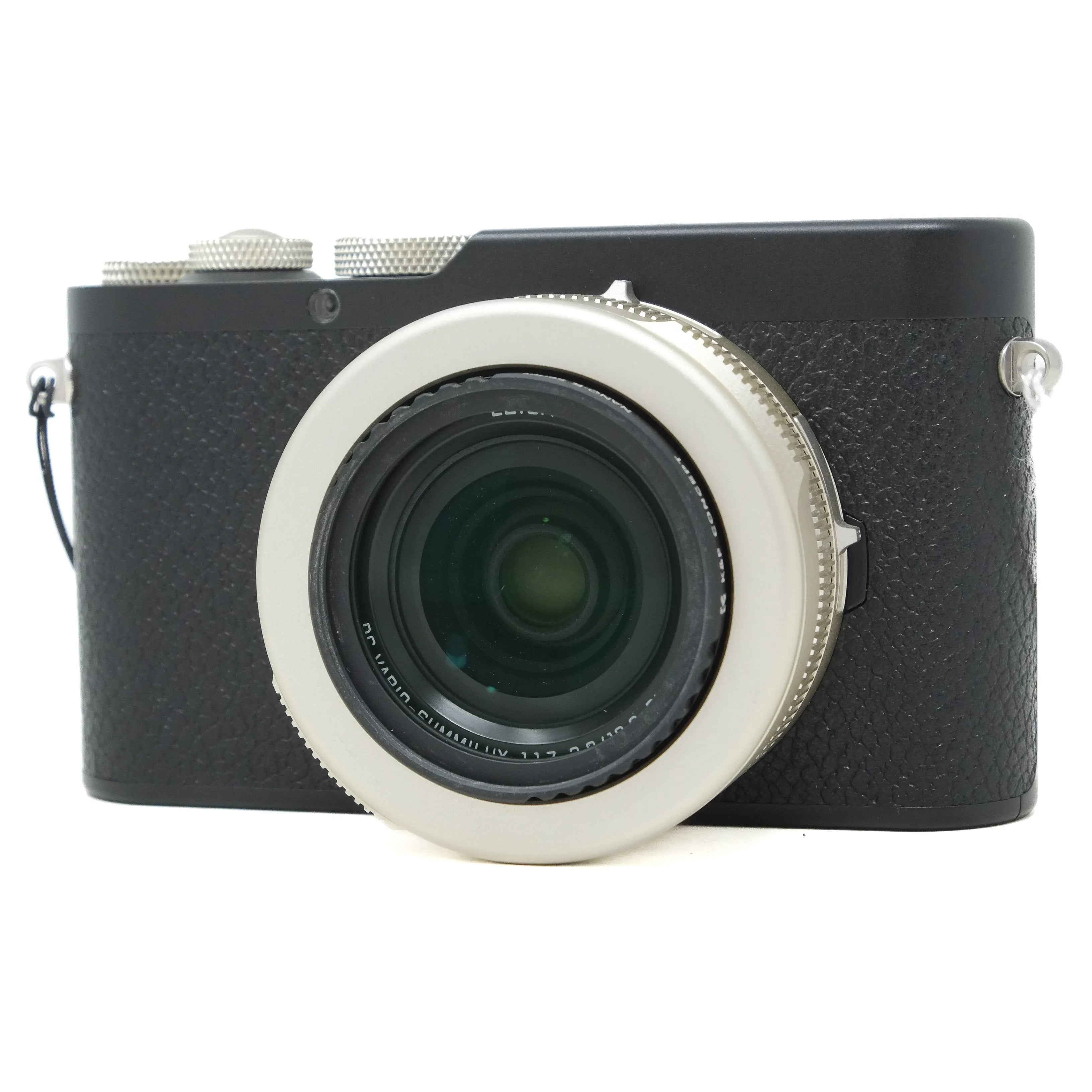 Black camera with a silver lens on a white background