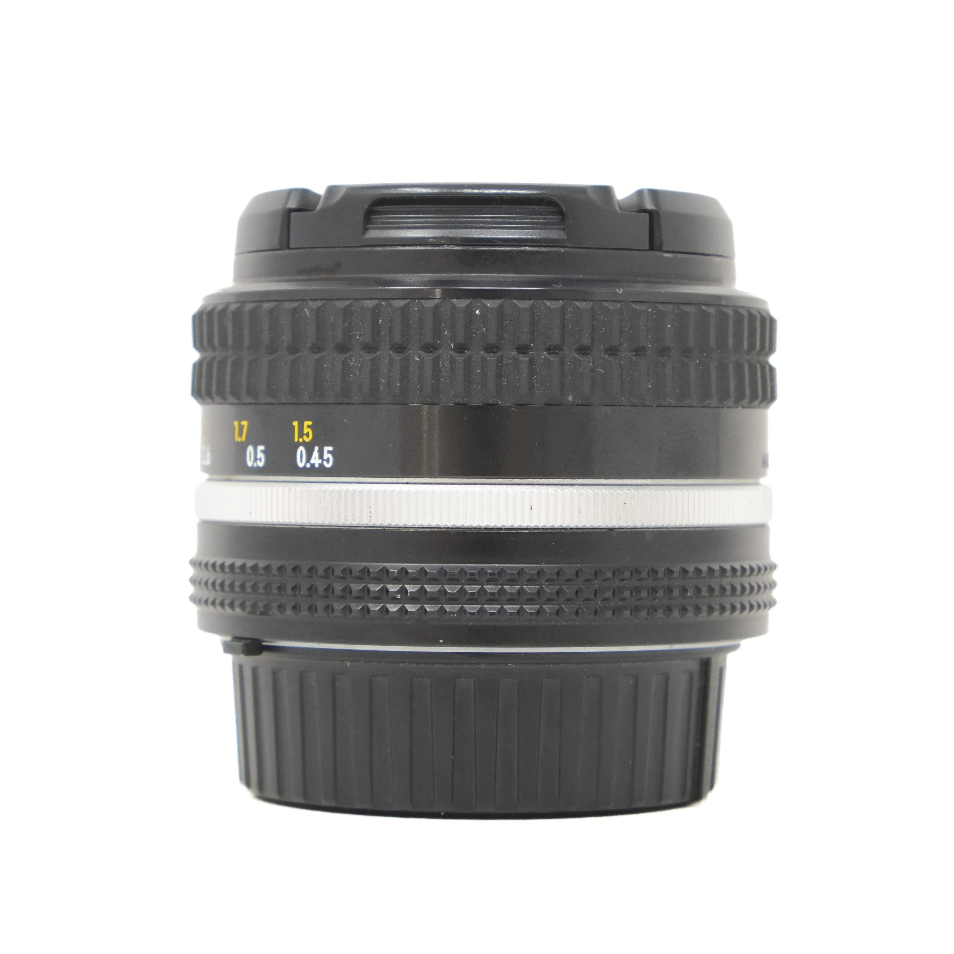 Camera lens with focus scale on a white background