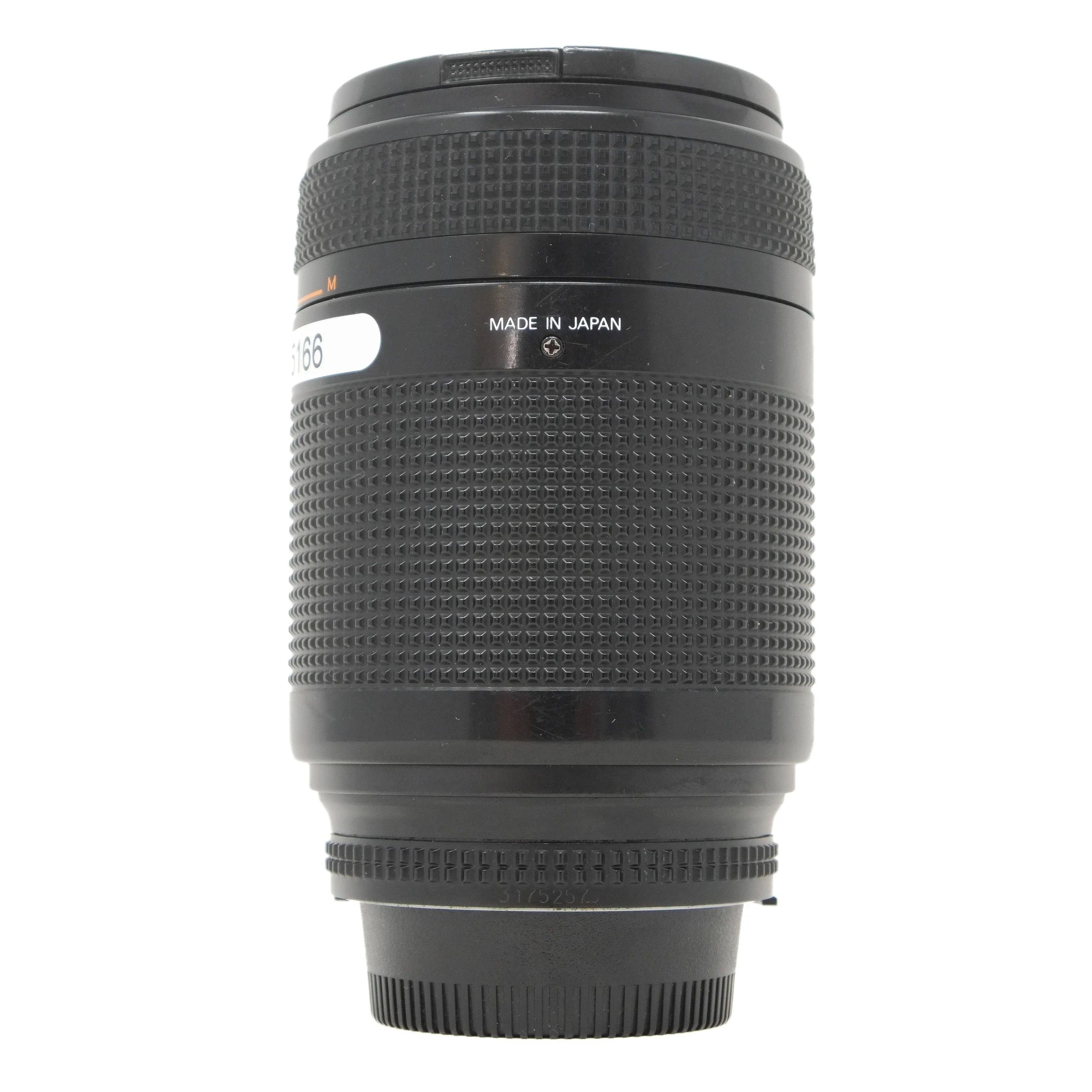 Camera lens with 'Made in Japan' text on a white background