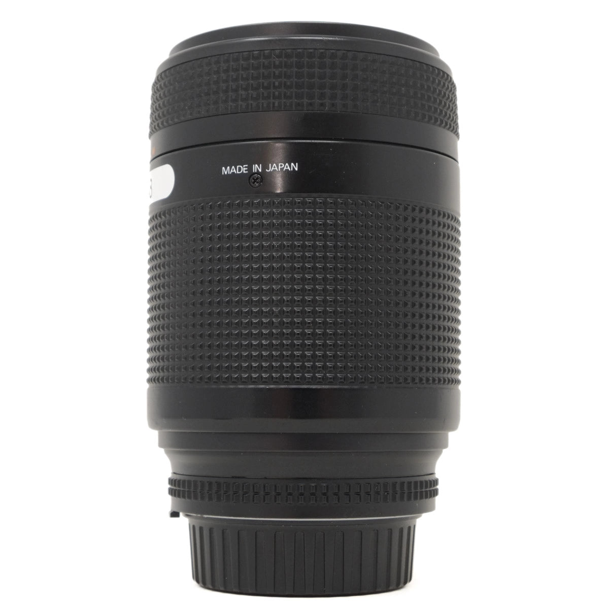 Black camera lens with 'Made in Japan' text on a white background