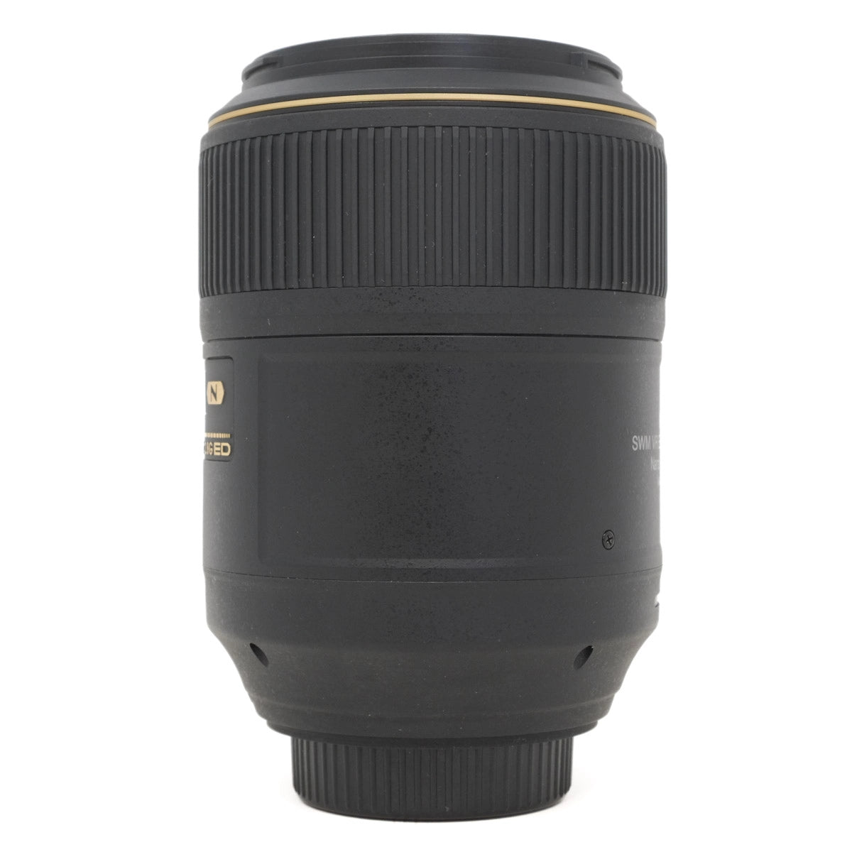 Camera lens with gold accents on a white background