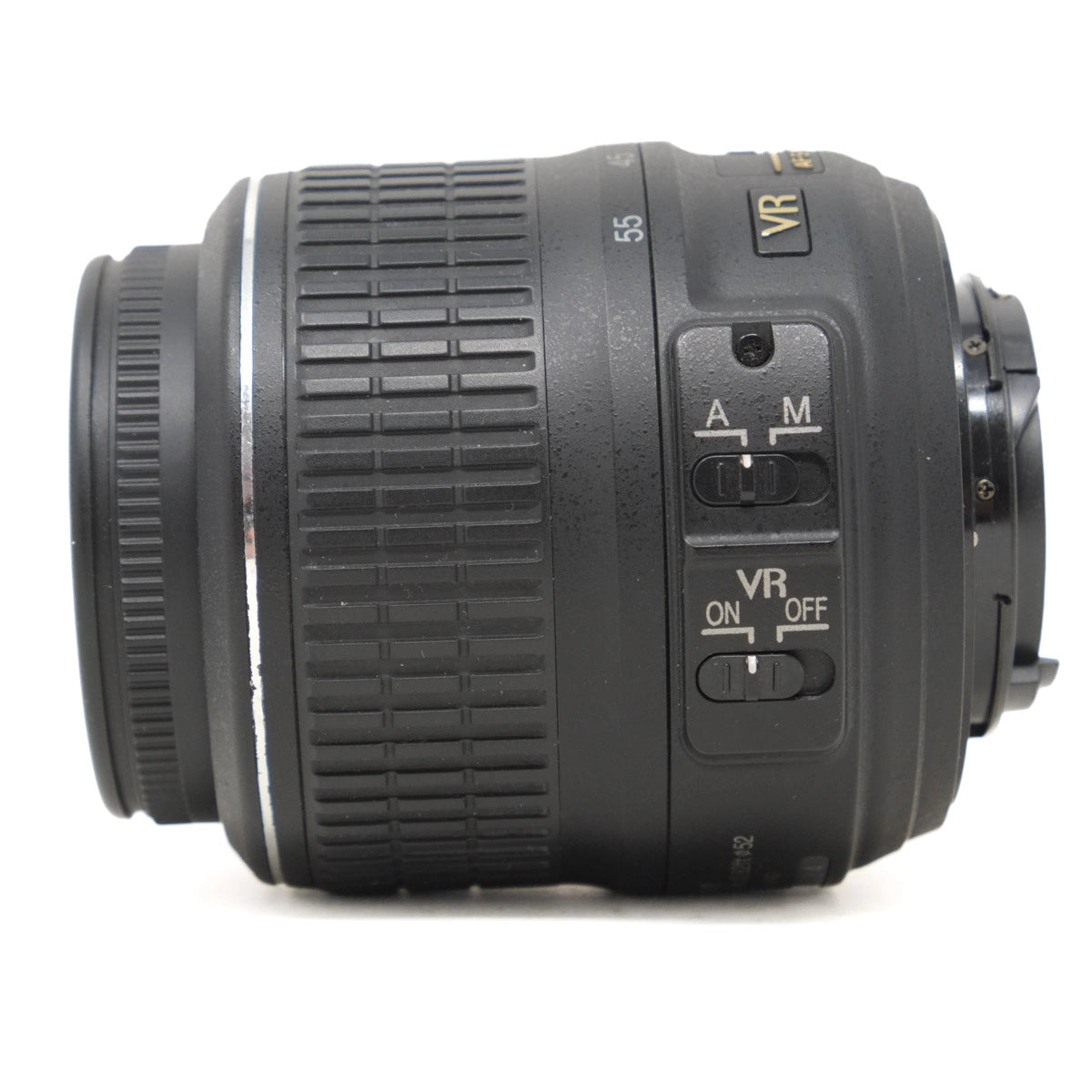 Camera lens with control buttons on a white background