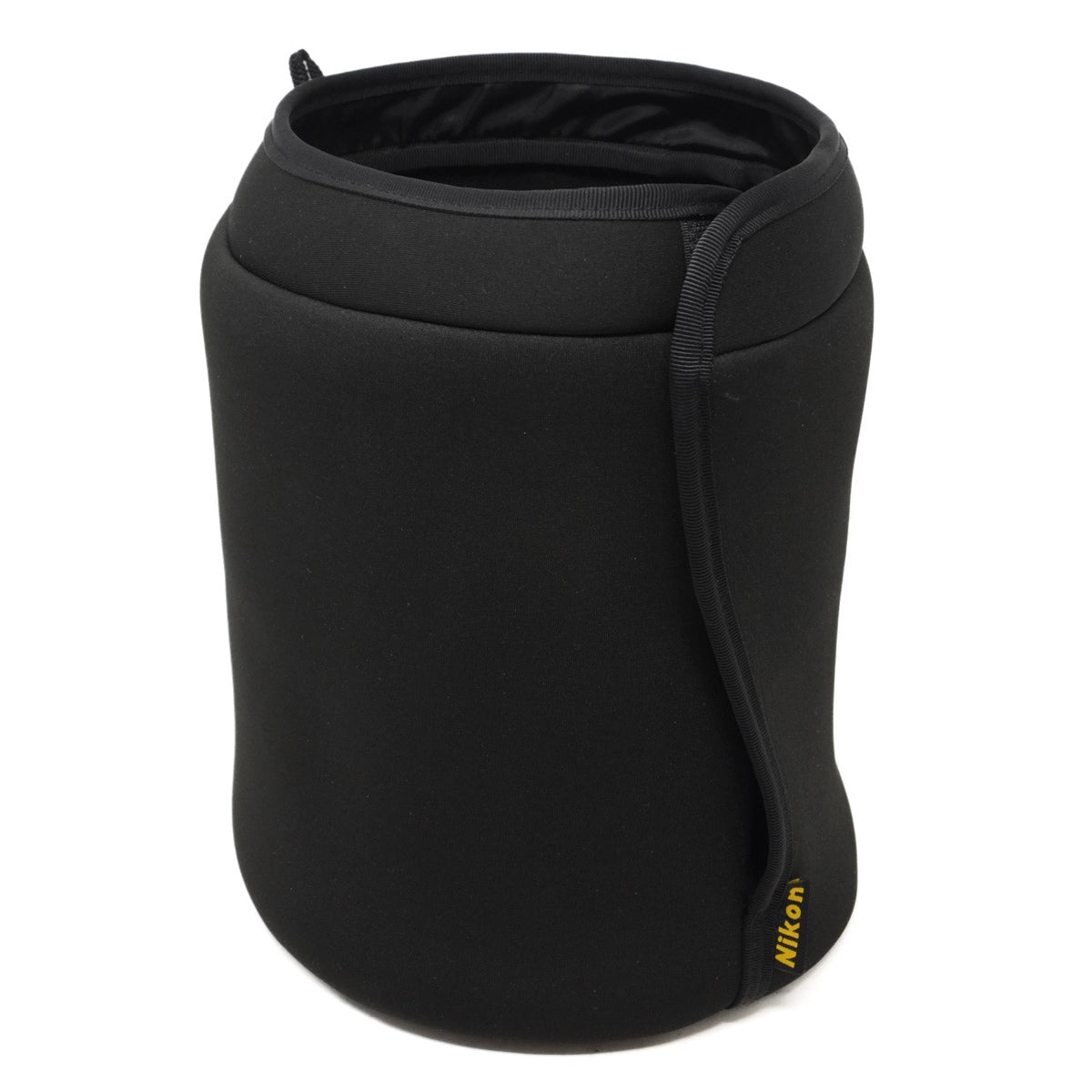 Black camera lens cover with Nikon logo on a white background