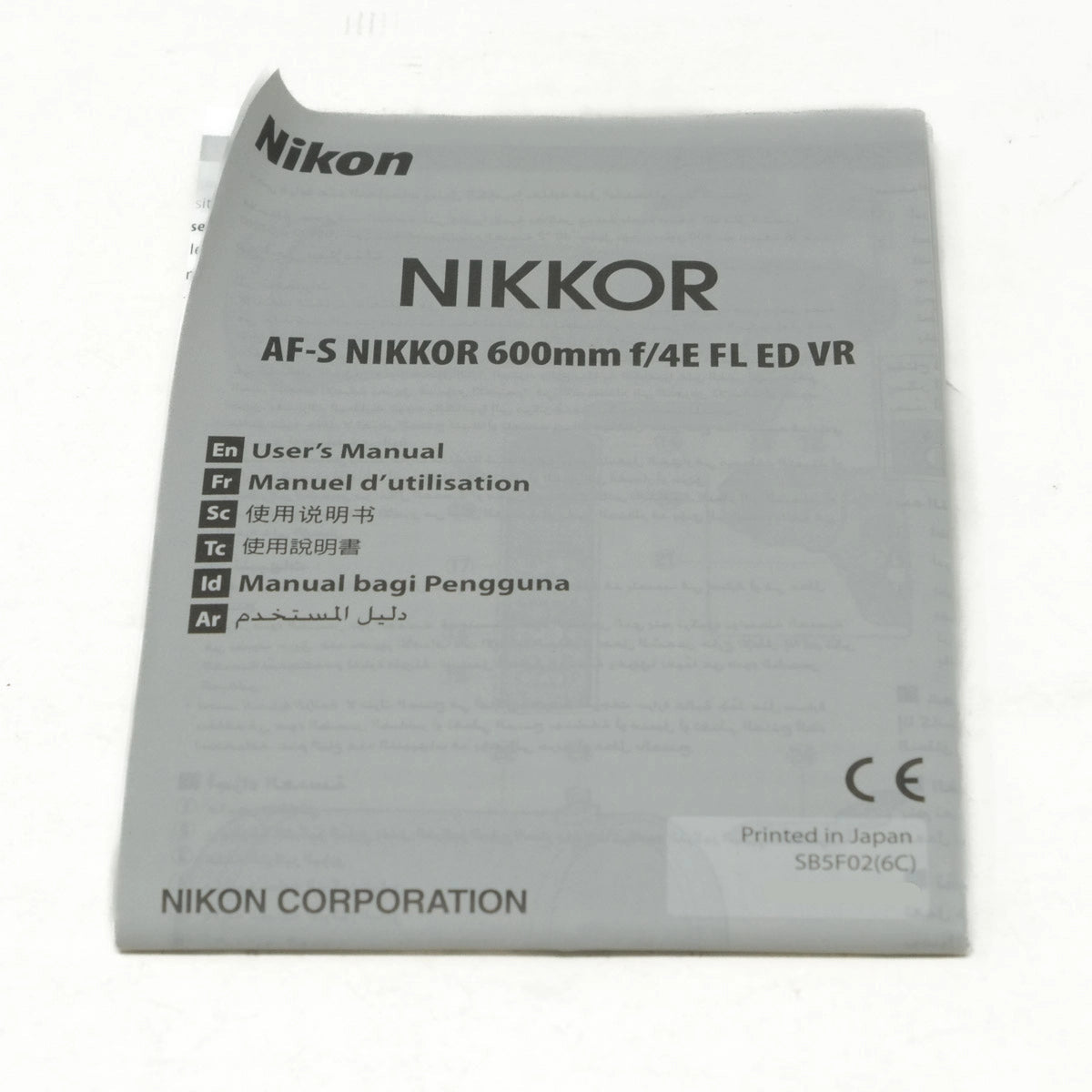 Nikon Nikkor camera lens user manual on a white background
