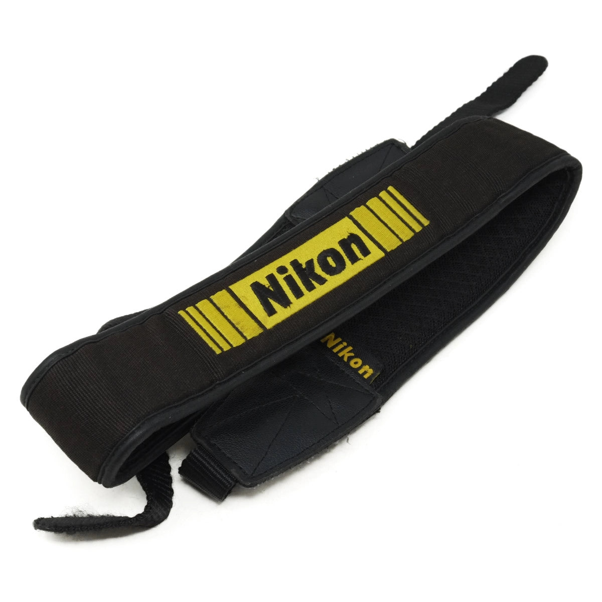 Black camera strap with yellow Nikon logo on a white background