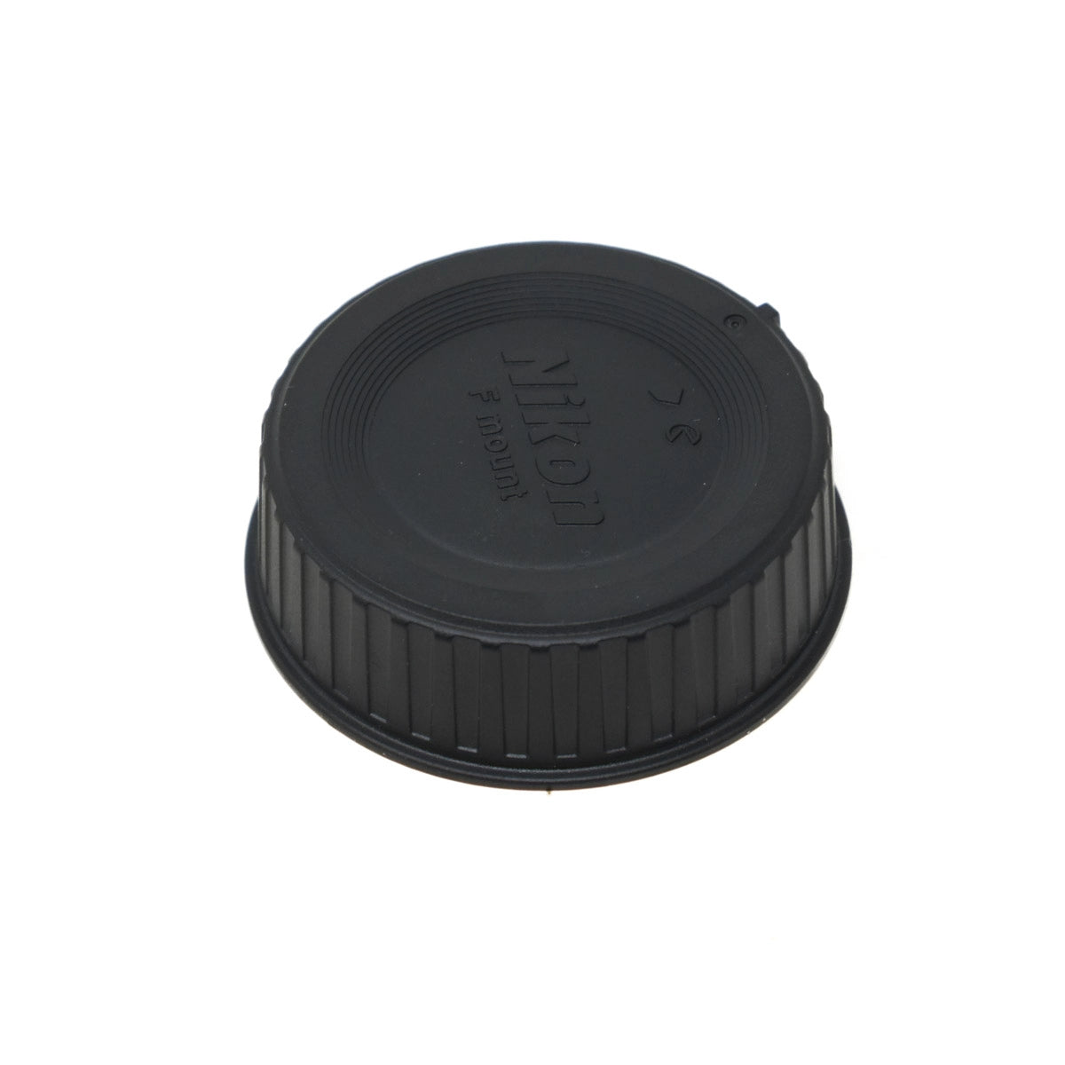 Black Nikon camera lens cap on a white background