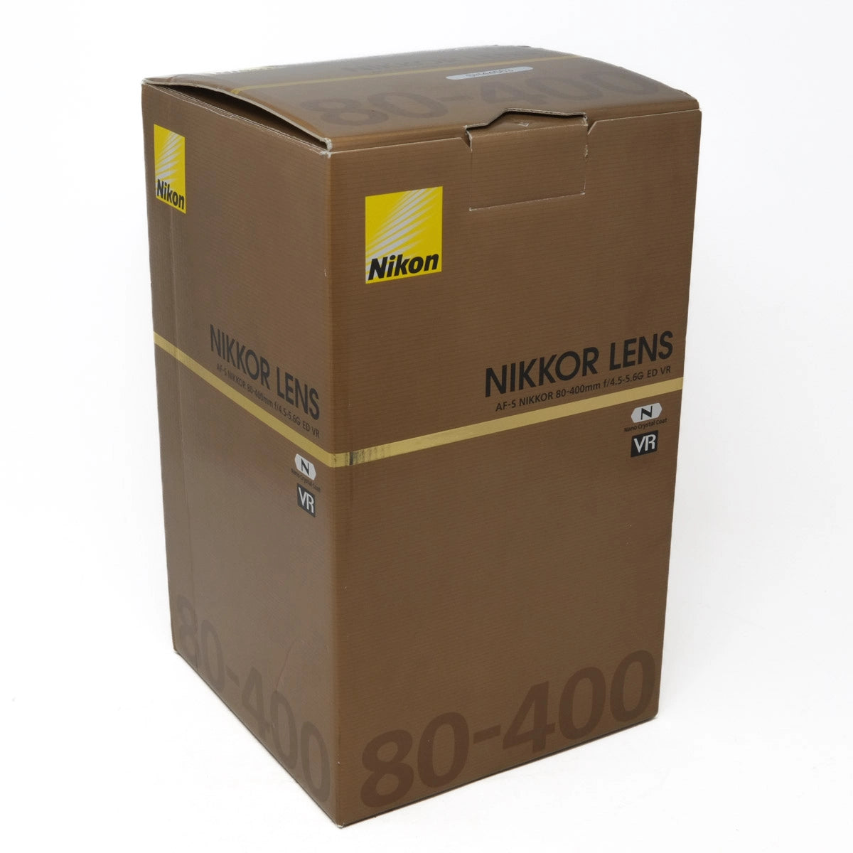 Brown Nikon Nikkor lens box on a white background