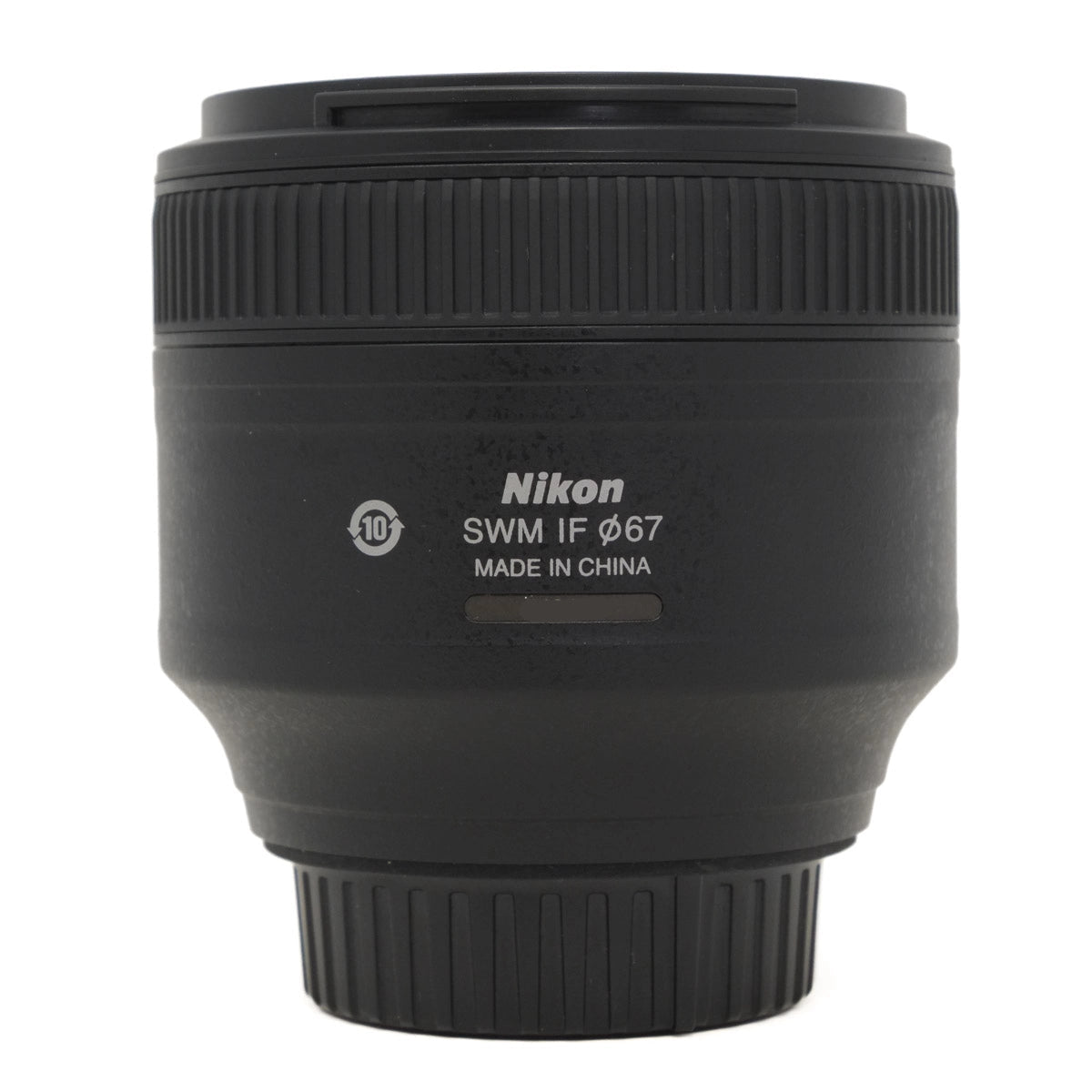 Black Nikon camera lens on a white background