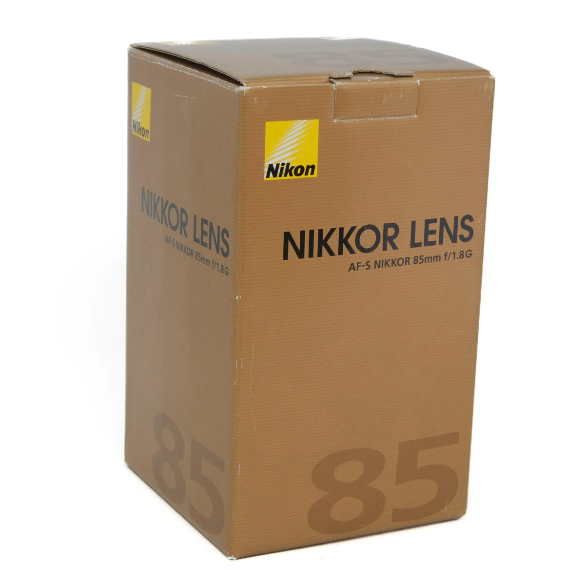 Cardboard box with Nikon Nikkor lens branding on a white background