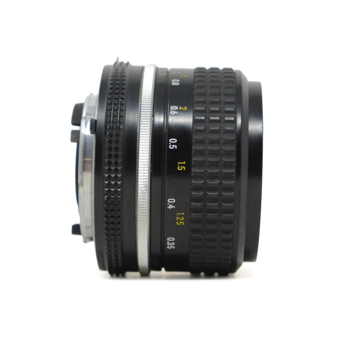 Camera lens with focus scale on a white background