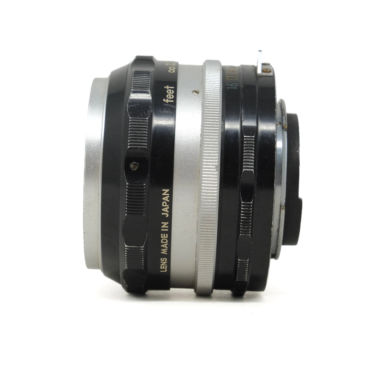 Camera lens with 'Made in Japan' text on a white background