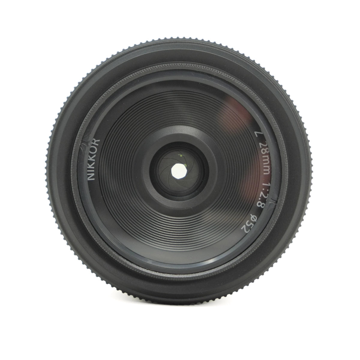 Camera lens with 'Nikon' branding on a white background