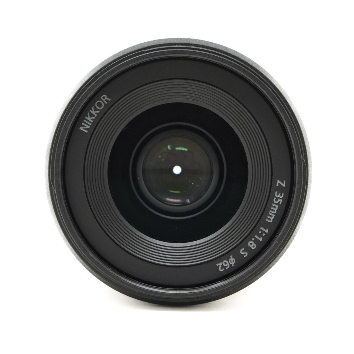 Camera lens with 'Nikkor' branding on a white background