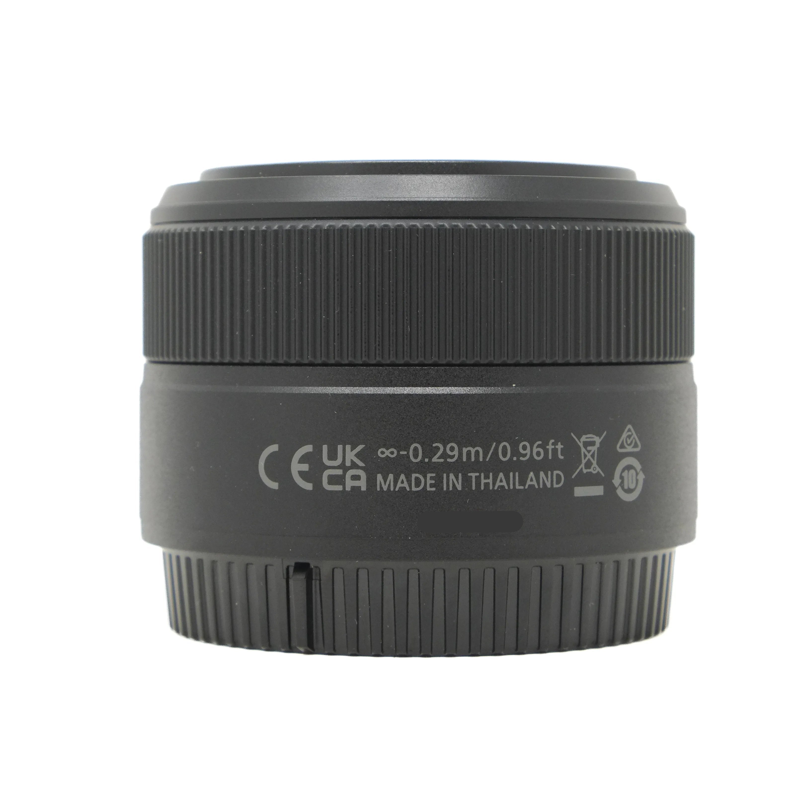 Black camera lens with text and symbols on a white background