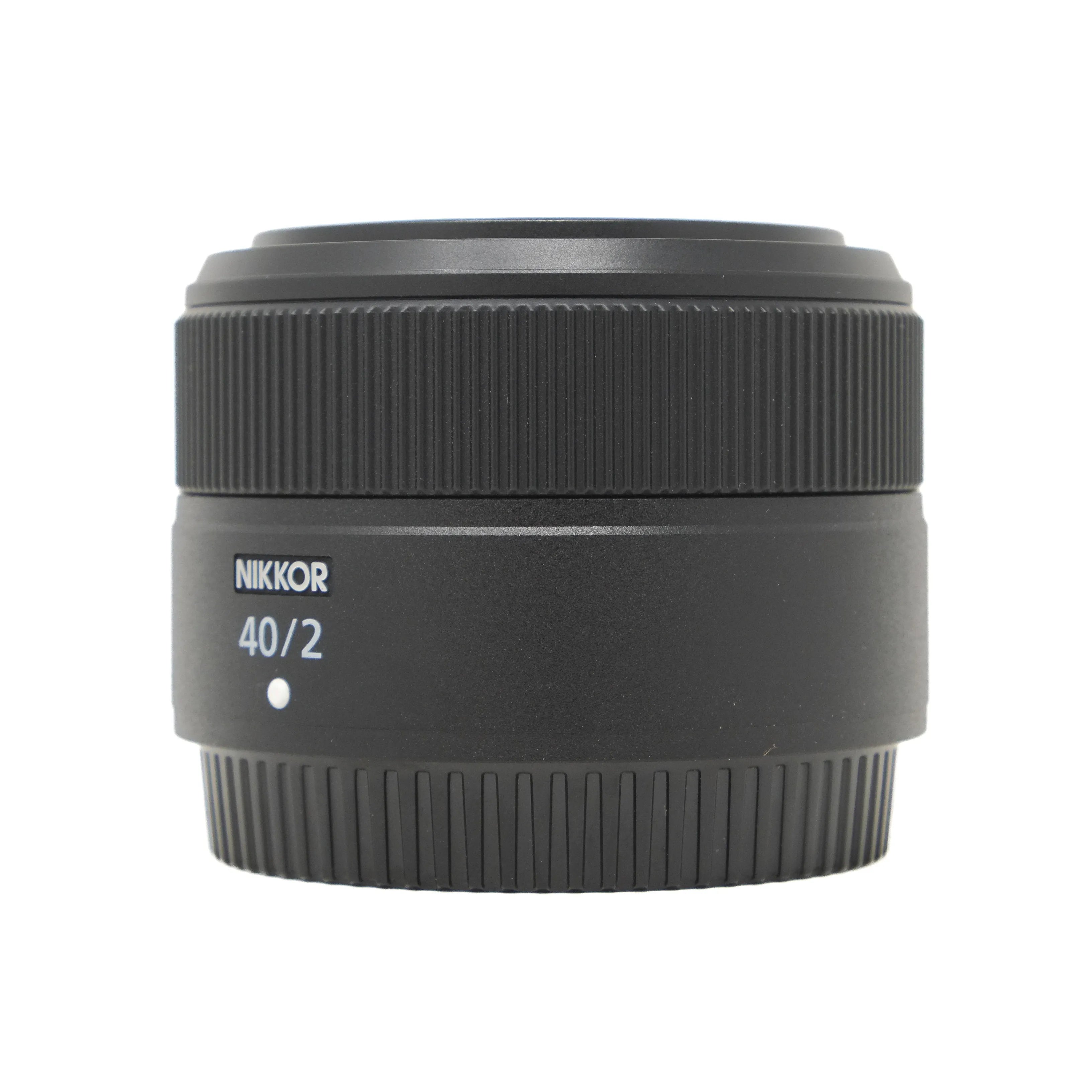 Camera lens with 'Nikkor' branding on a white background