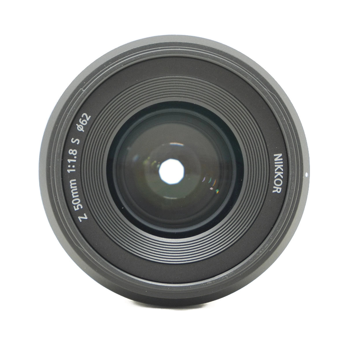 Camera lens with 'Nikkor' branding on a white background