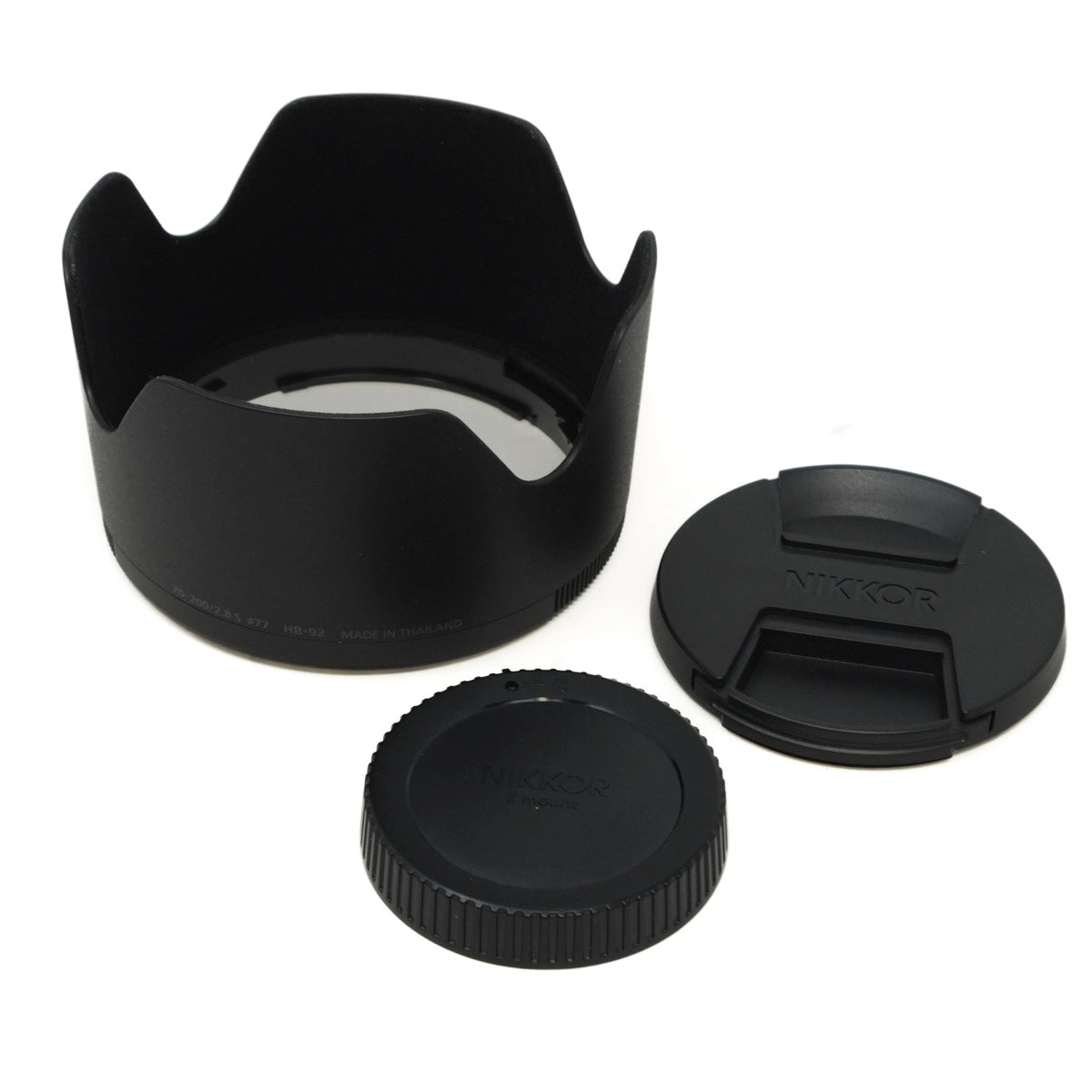 Camera lens hood and caps on a white background