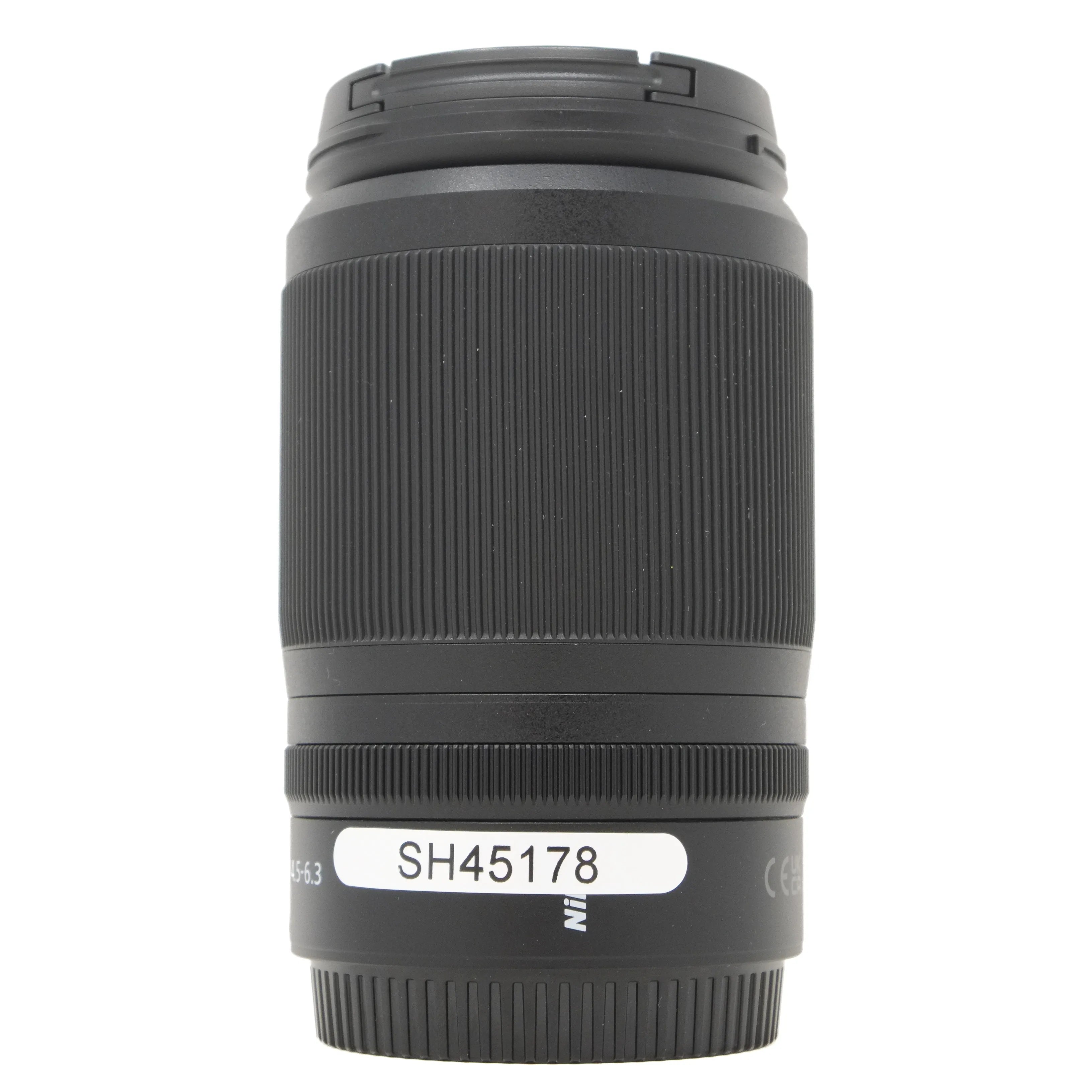 Black camera lens with visible Nikon branding on a white background