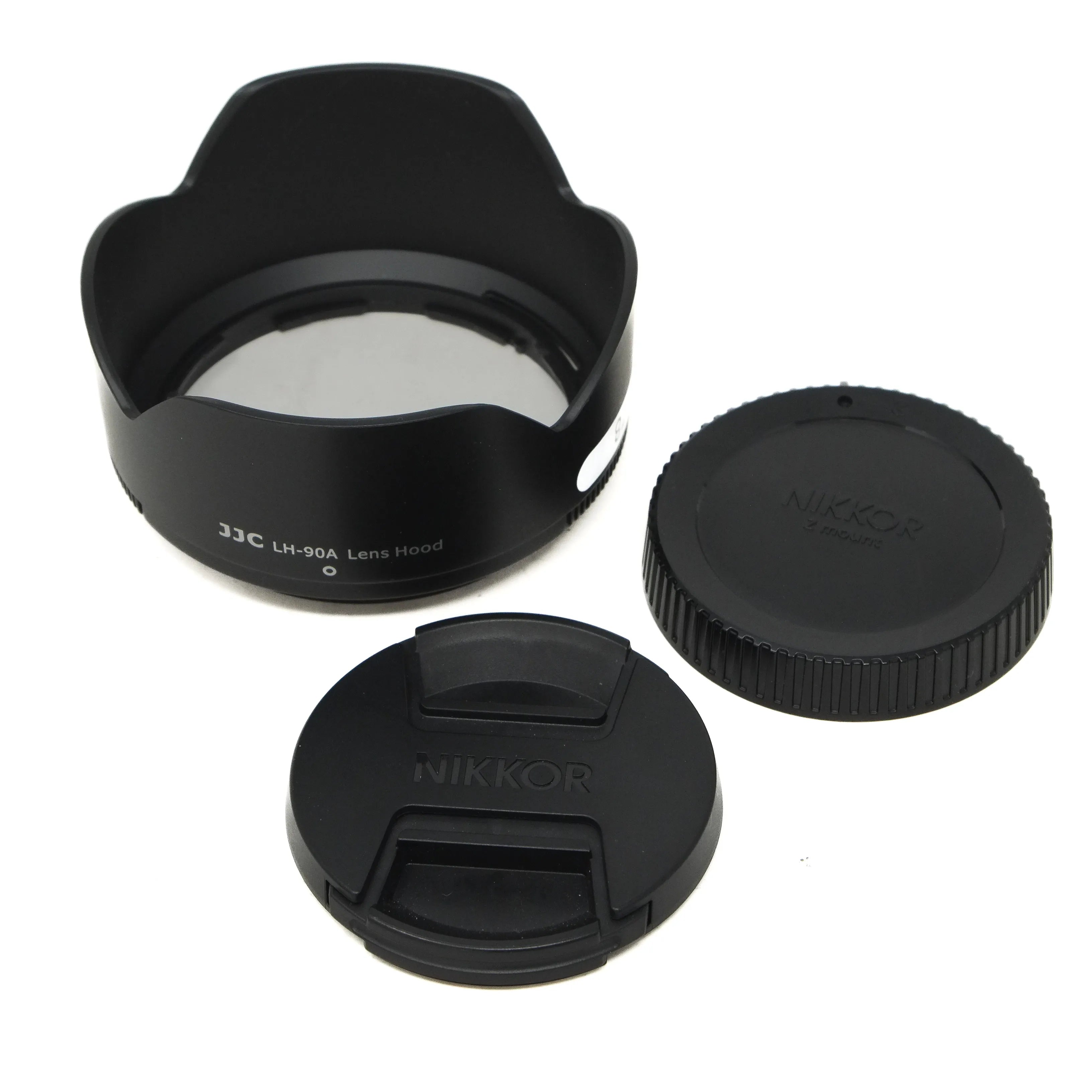 Camera lens hood and caps on a white background
