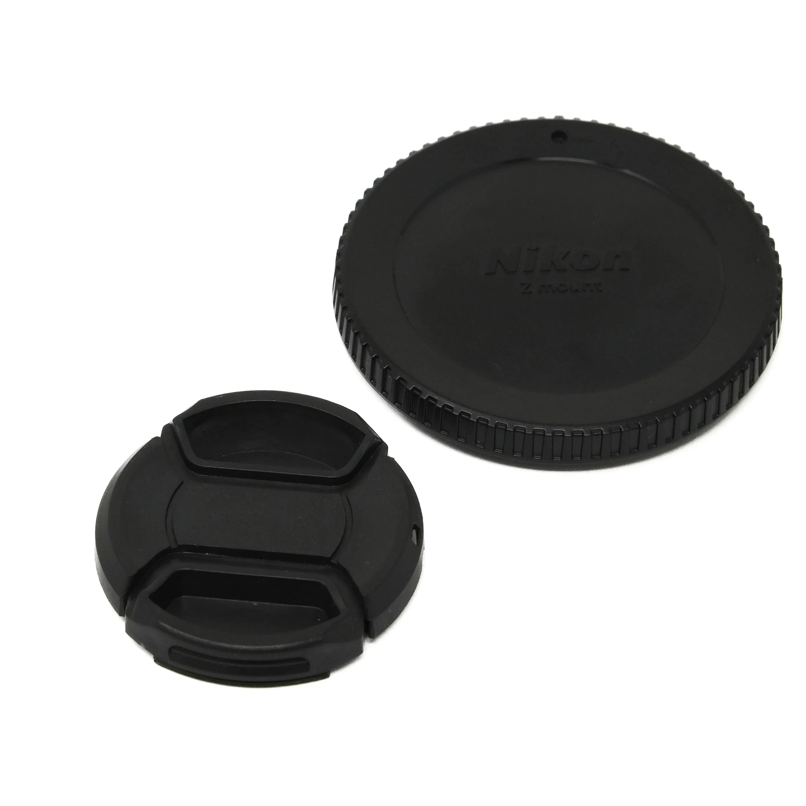 Black camera lens cap and body cap on a white background