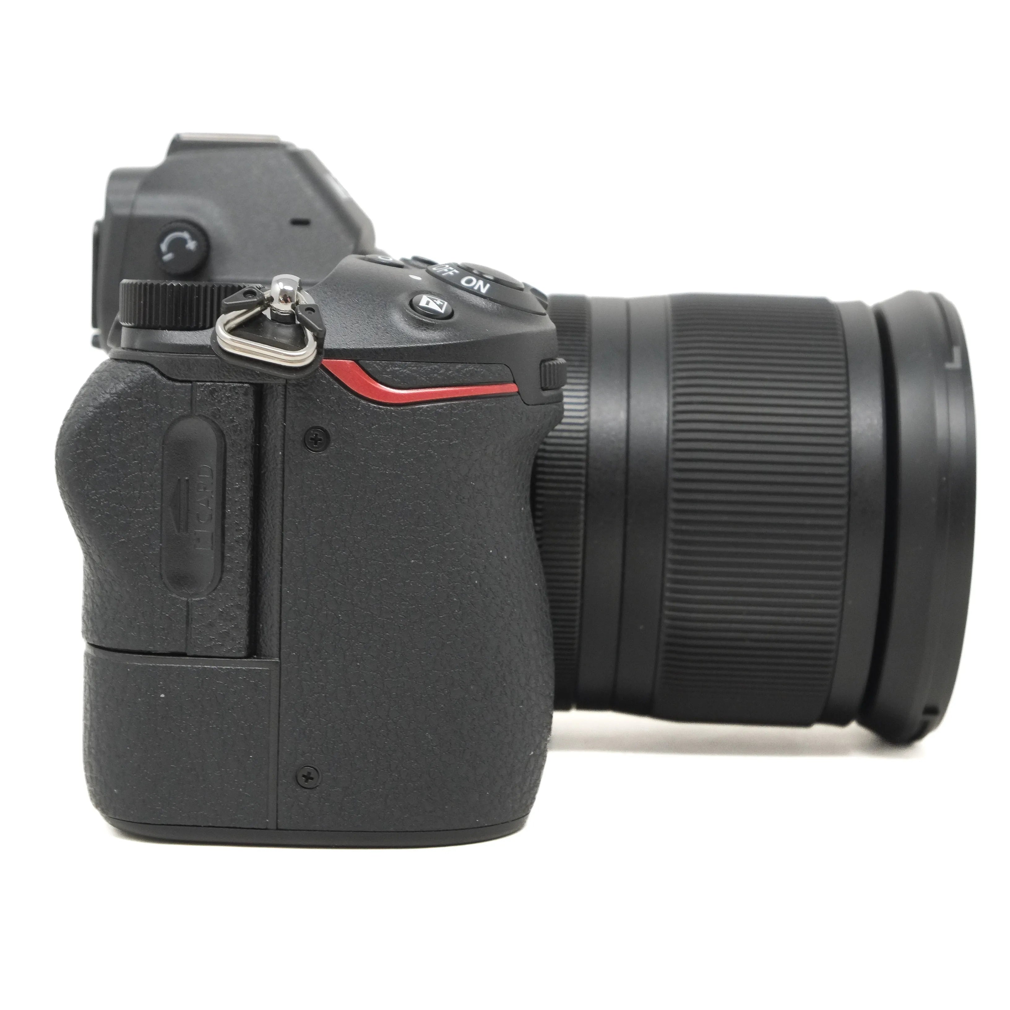Black camera with lens on a white background