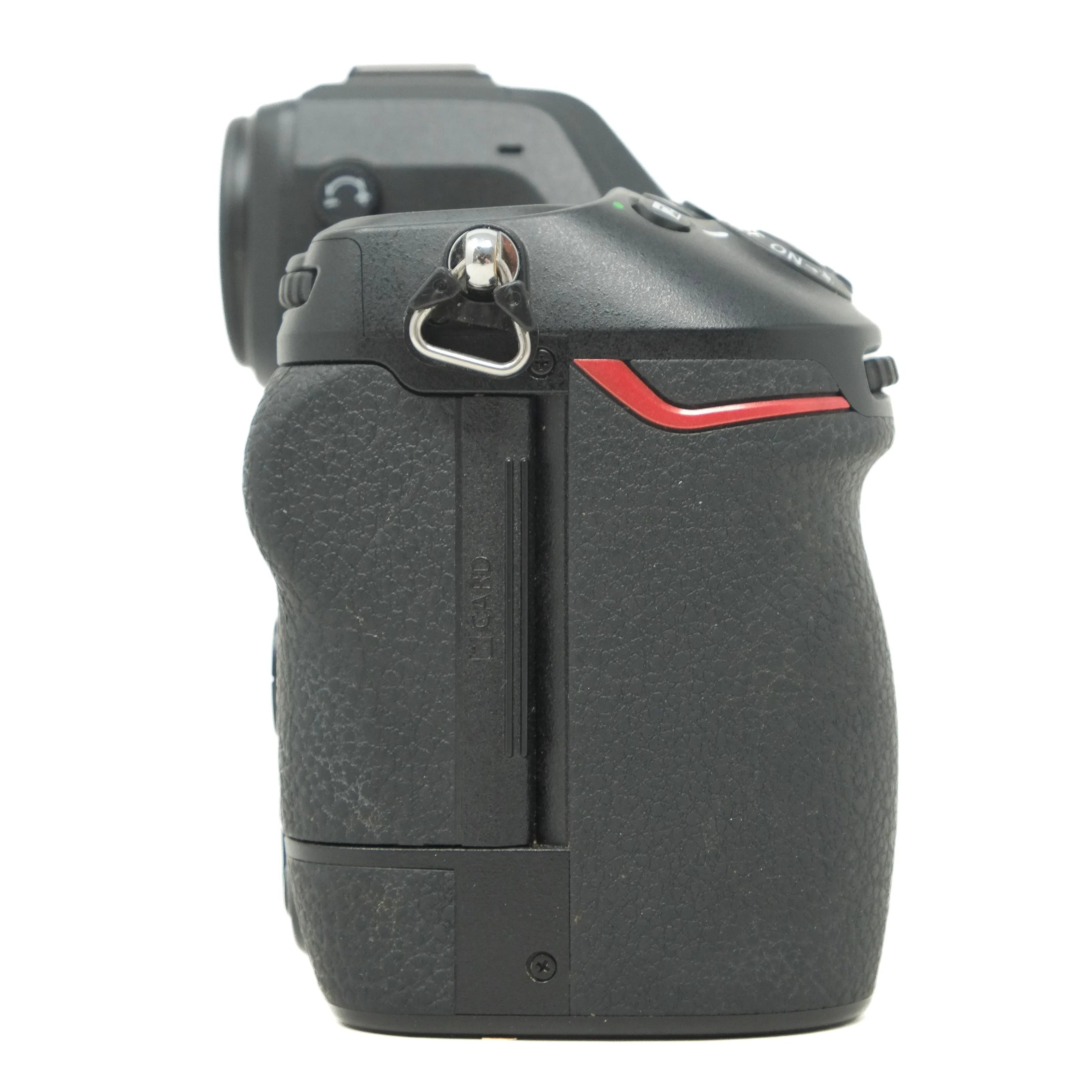 Close-up of a camera body with a red accent on a white background
