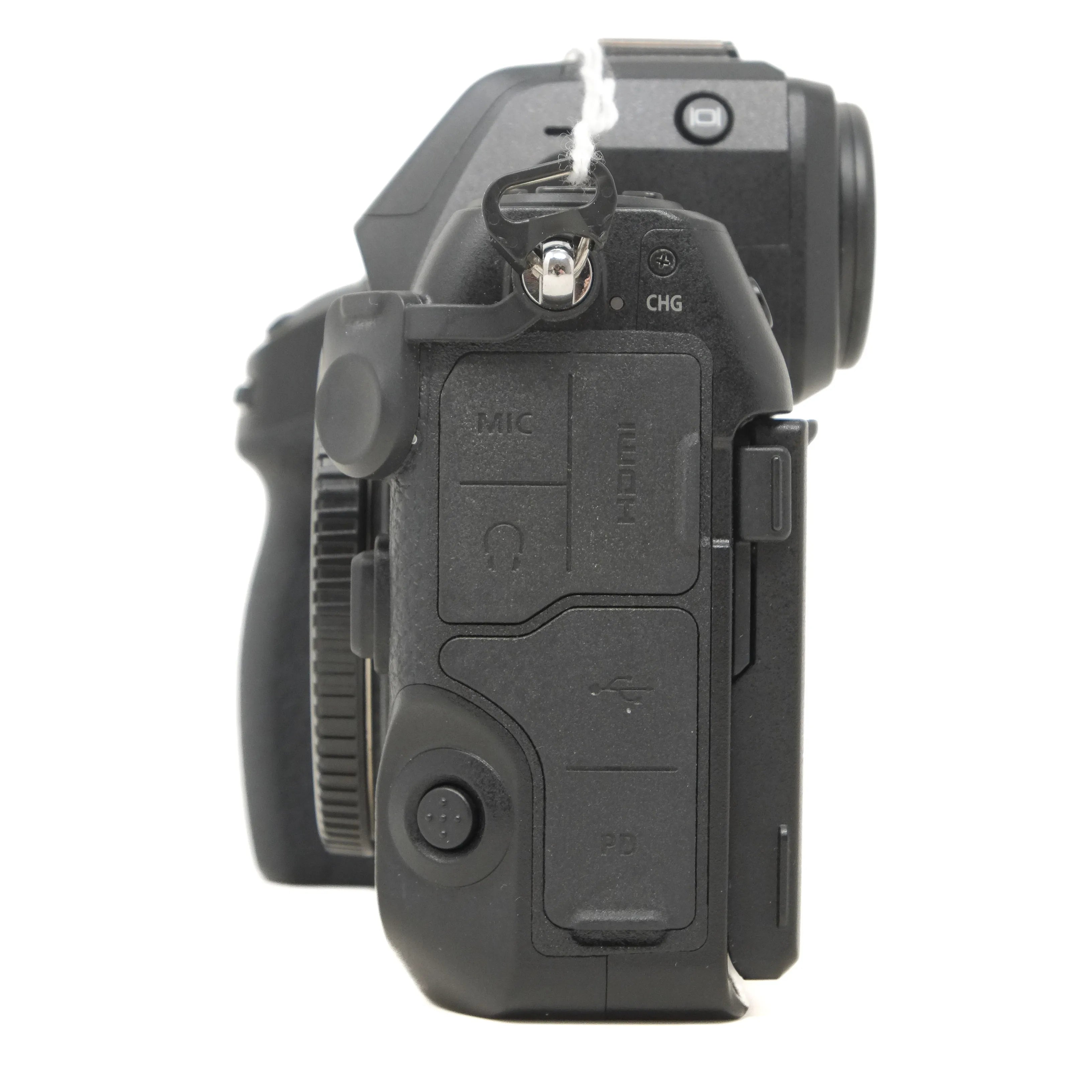 Side view of a black camera body on a white background