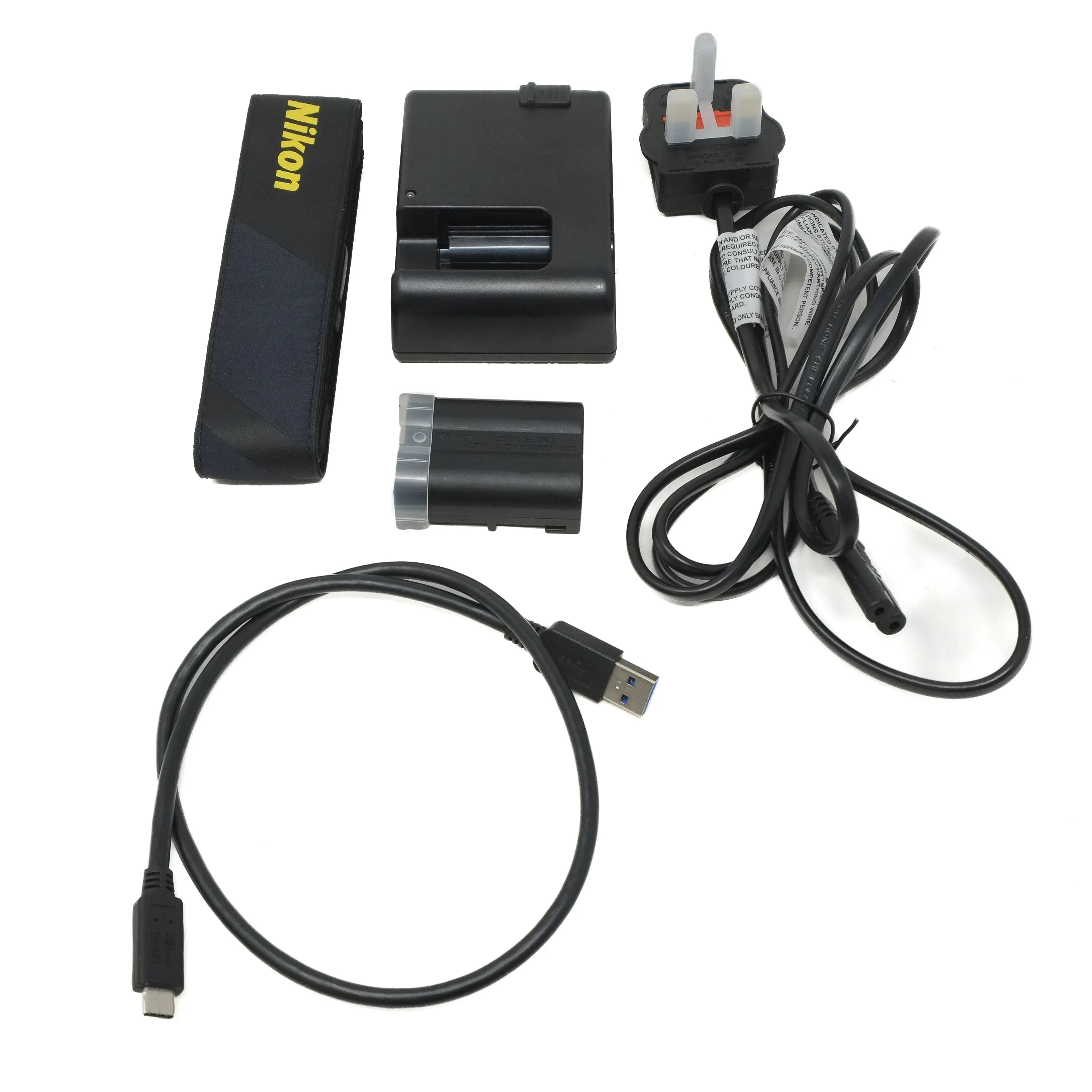 Collection of electronic accessories including a battery, charger, and cables on a white background