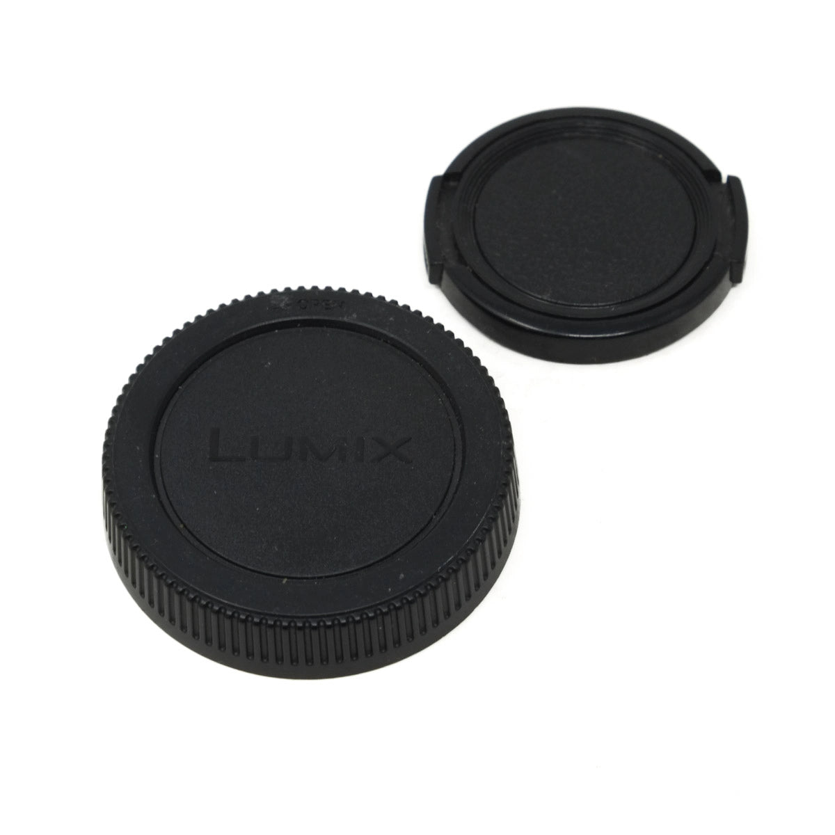 Two black camera lens caps with 'LUMIX' branding on a white background