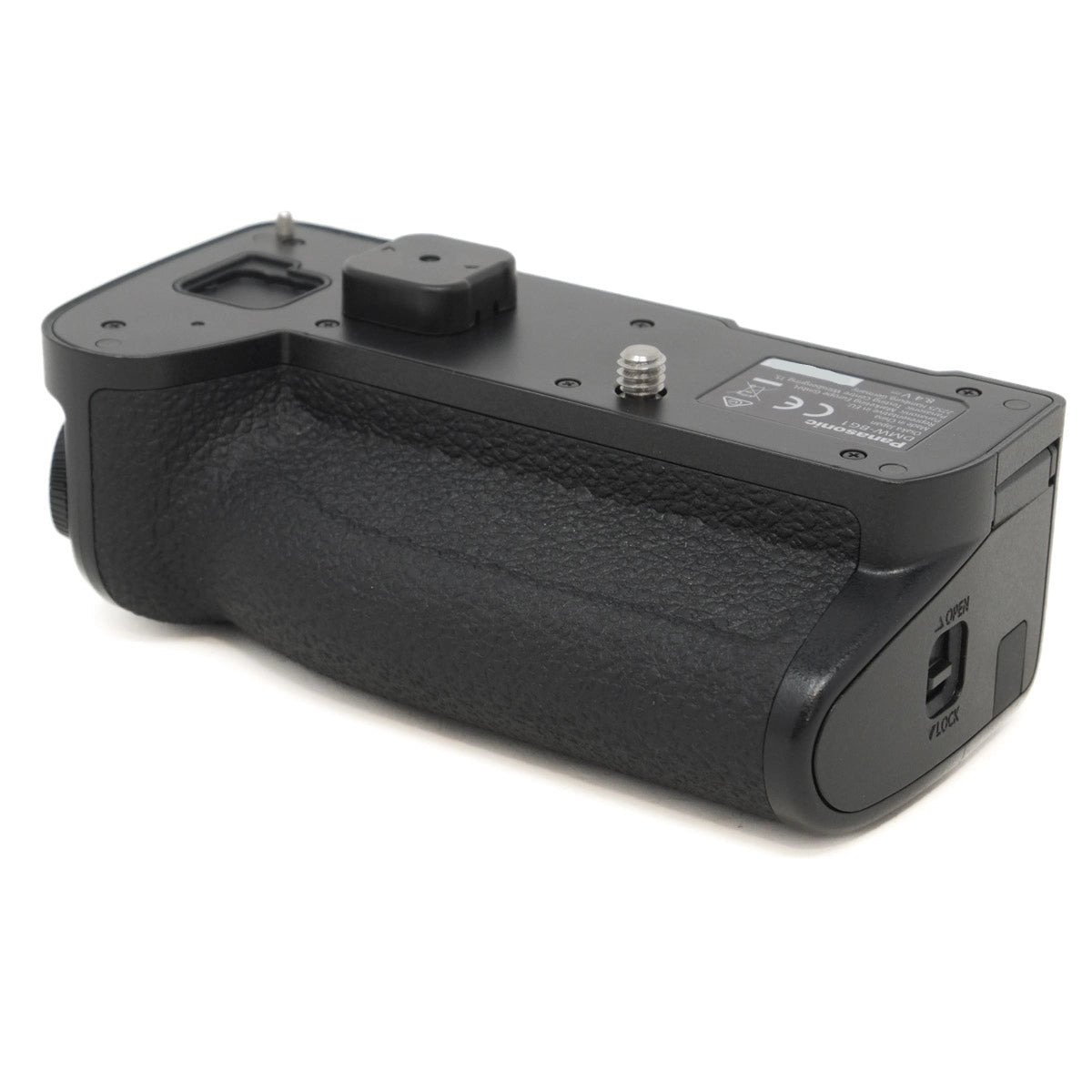 Black camera battery grip on a white background