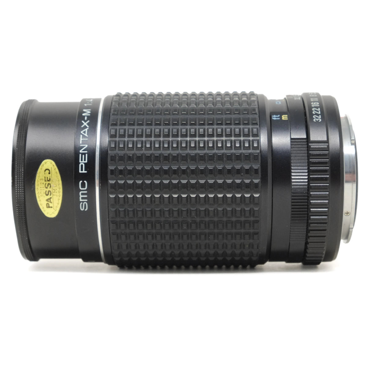 Camera lens with 'Pentax' branding on a white background