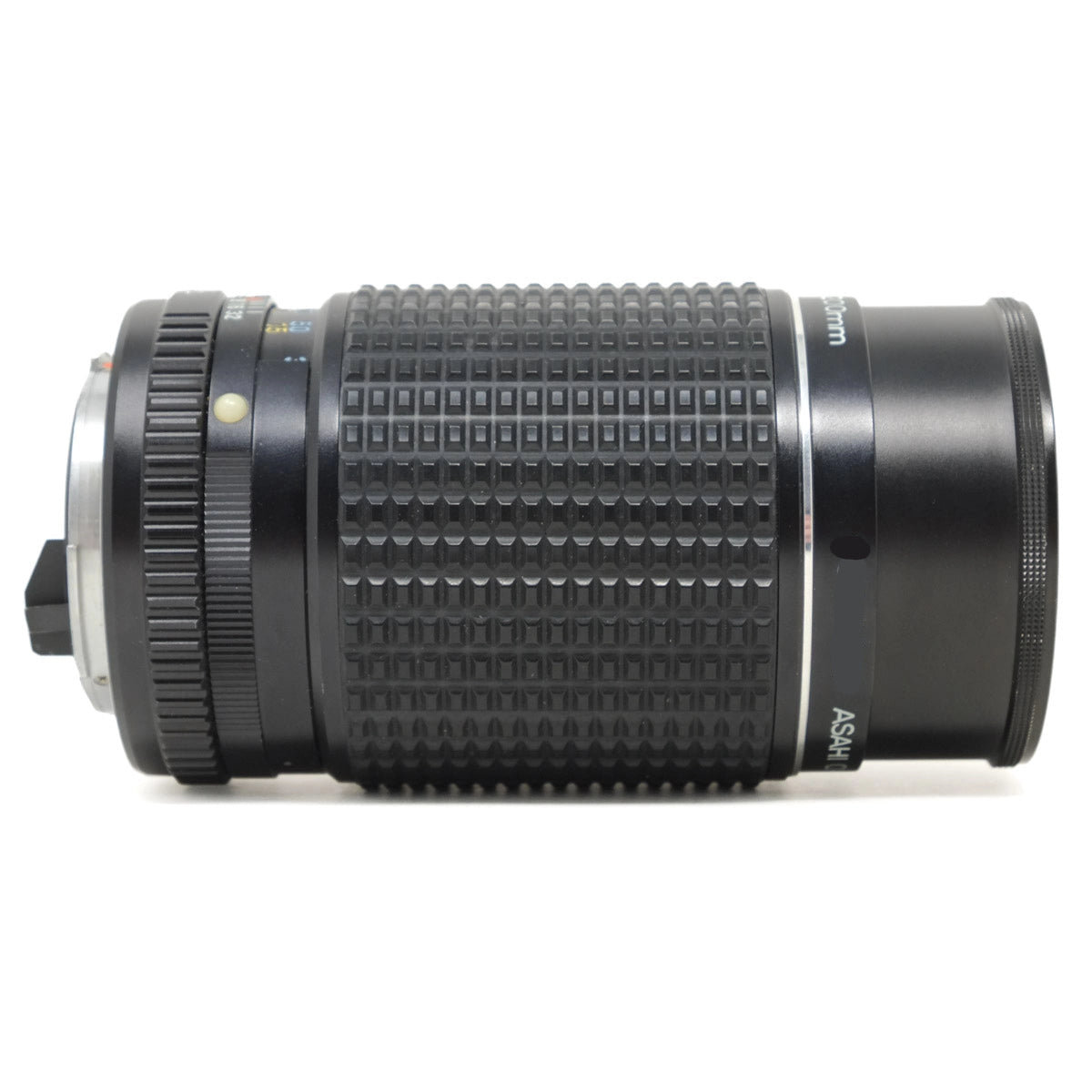 Camera lens with textured surface and visible brand name on a white background
