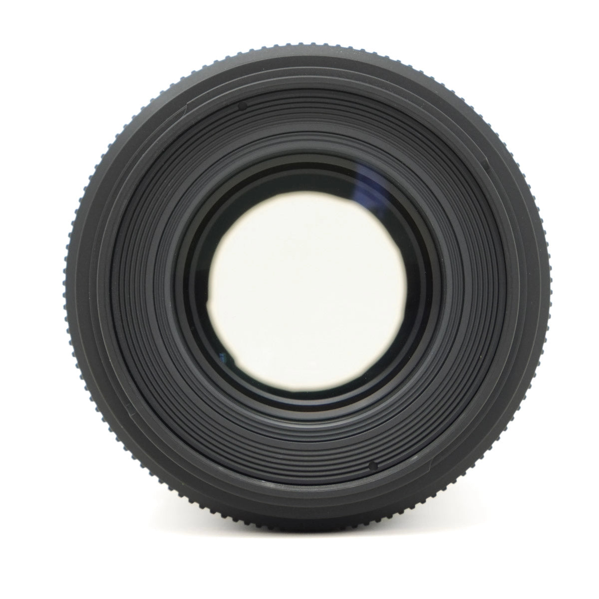 Close-up of a camera lens on a white background