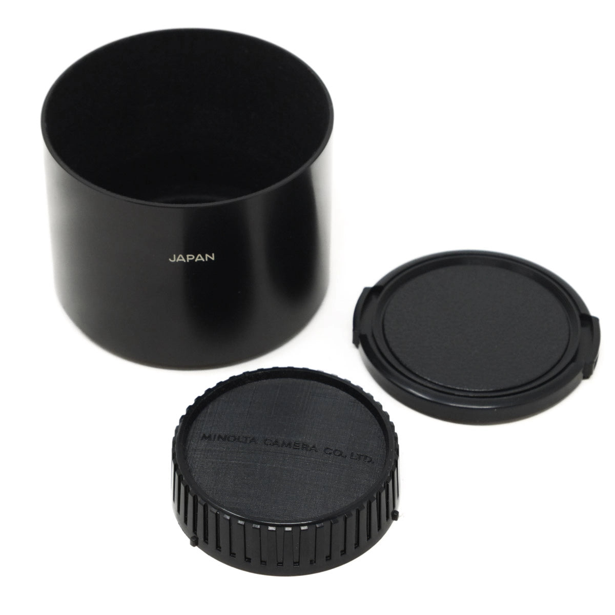 Black camera lens hood and caps on a white background