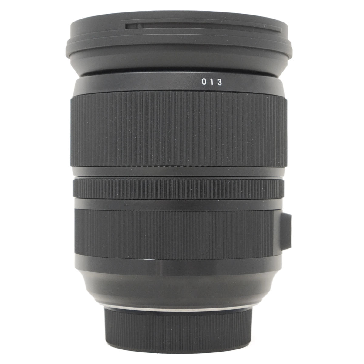 Black camera lens on a white background