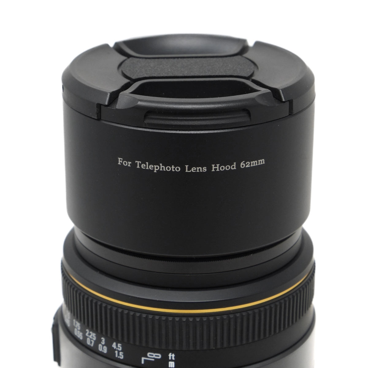 Black telephoto lens hood with text on a white background
