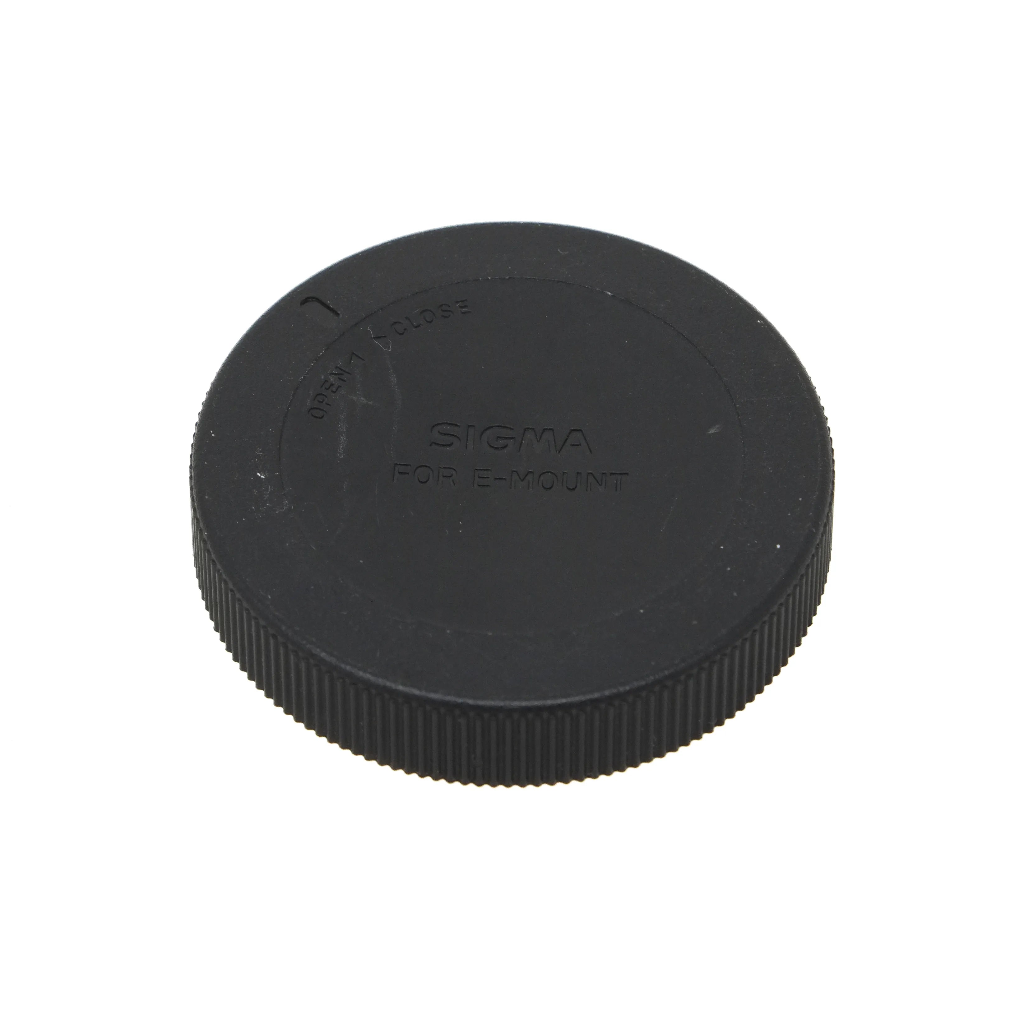Black camera lens cap with 'Sigma' branding on a white background