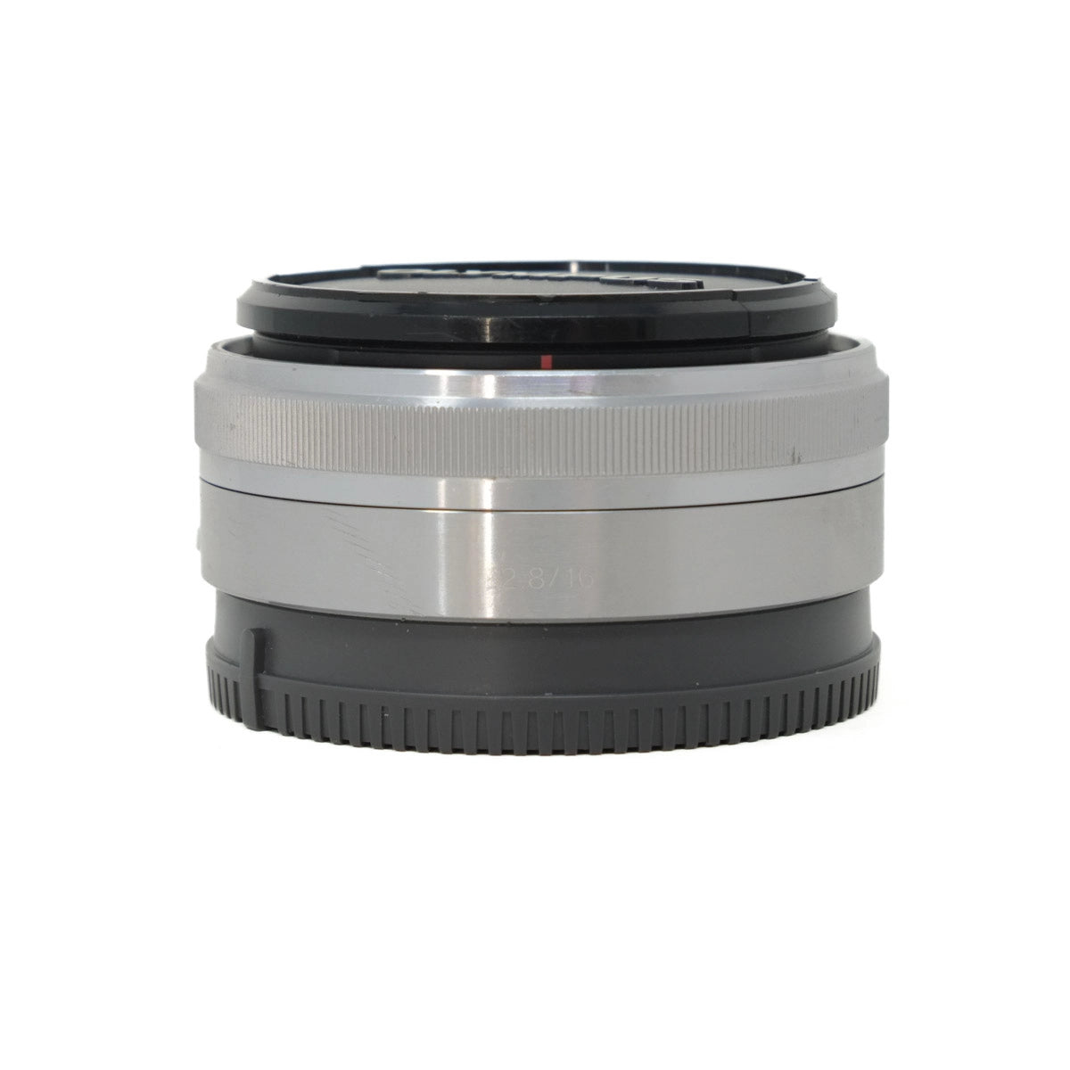 Camera lens with silver and black design on a white background
