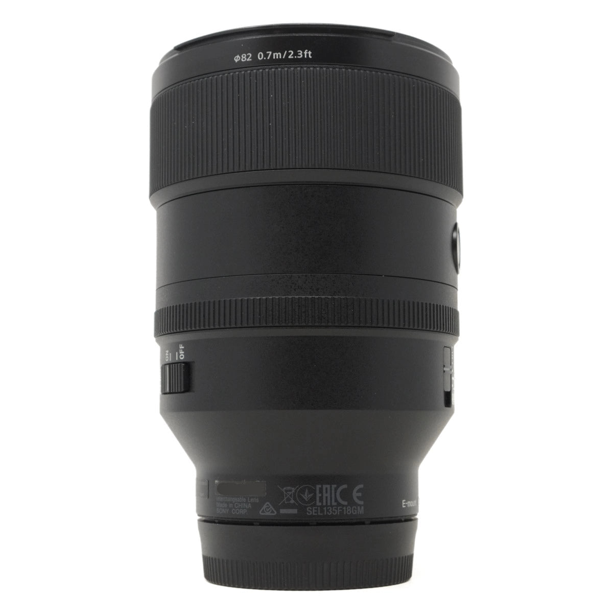 Black camera lens on a white background
