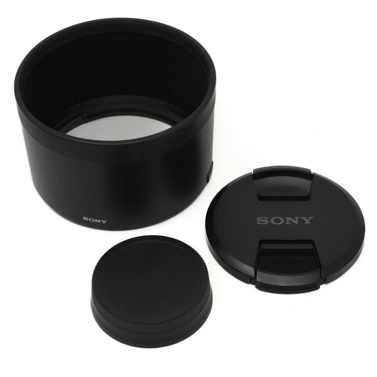 Sony lens hood and caps on a white background