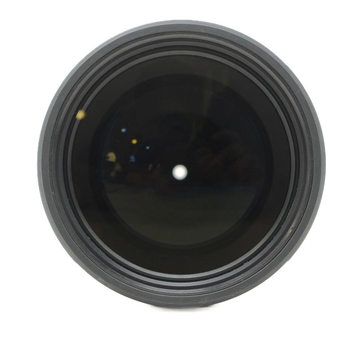 Close-up of a camera lens on a white background