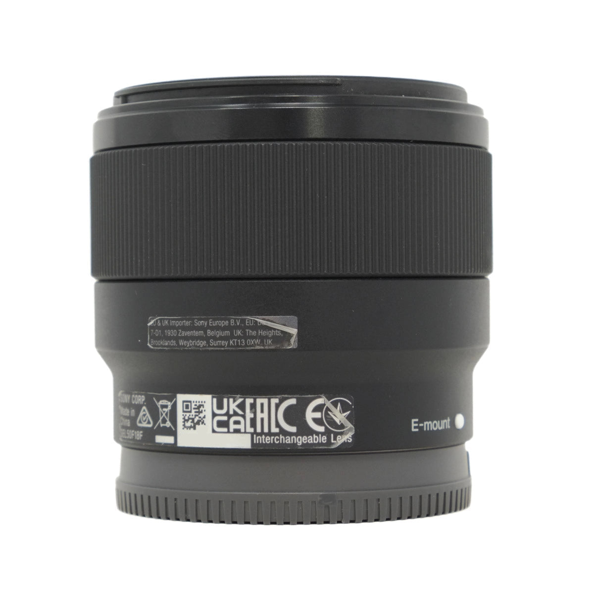 Black camera lens with visible branding on a white background