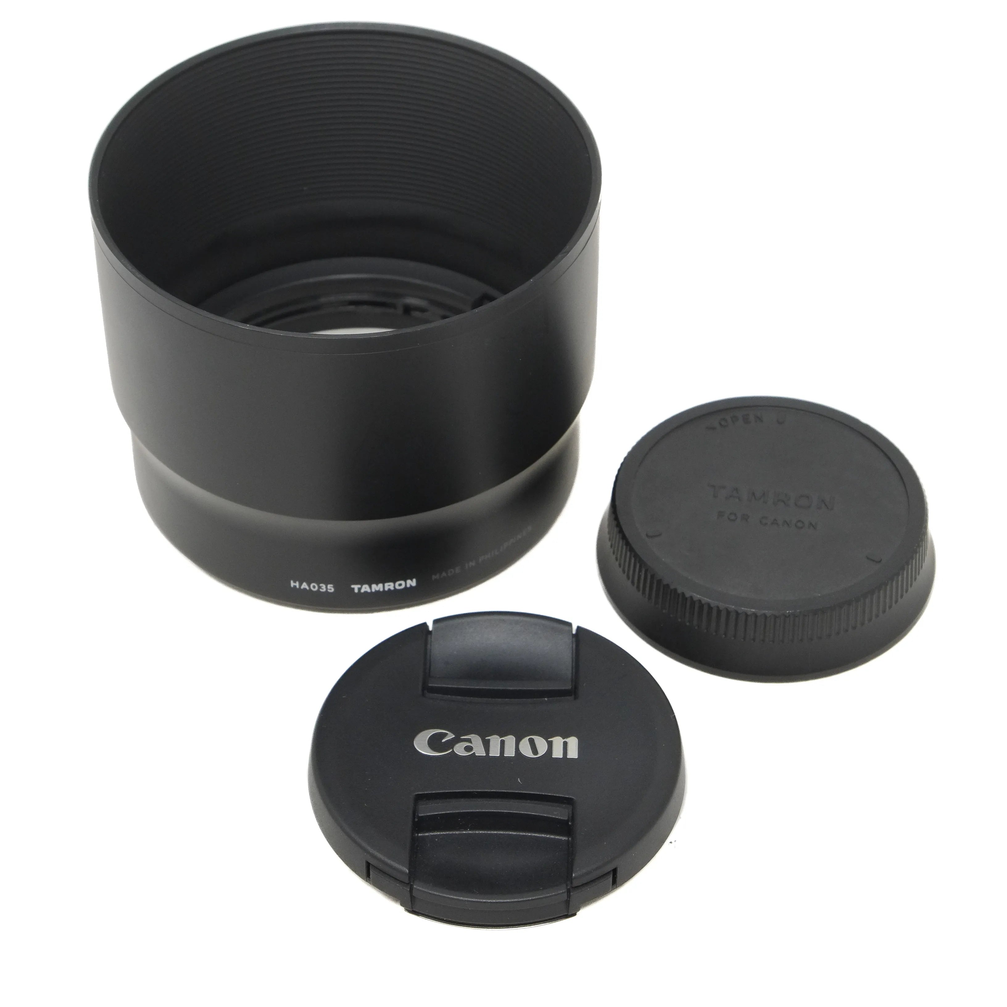 Camera lens hood and caps on a white background