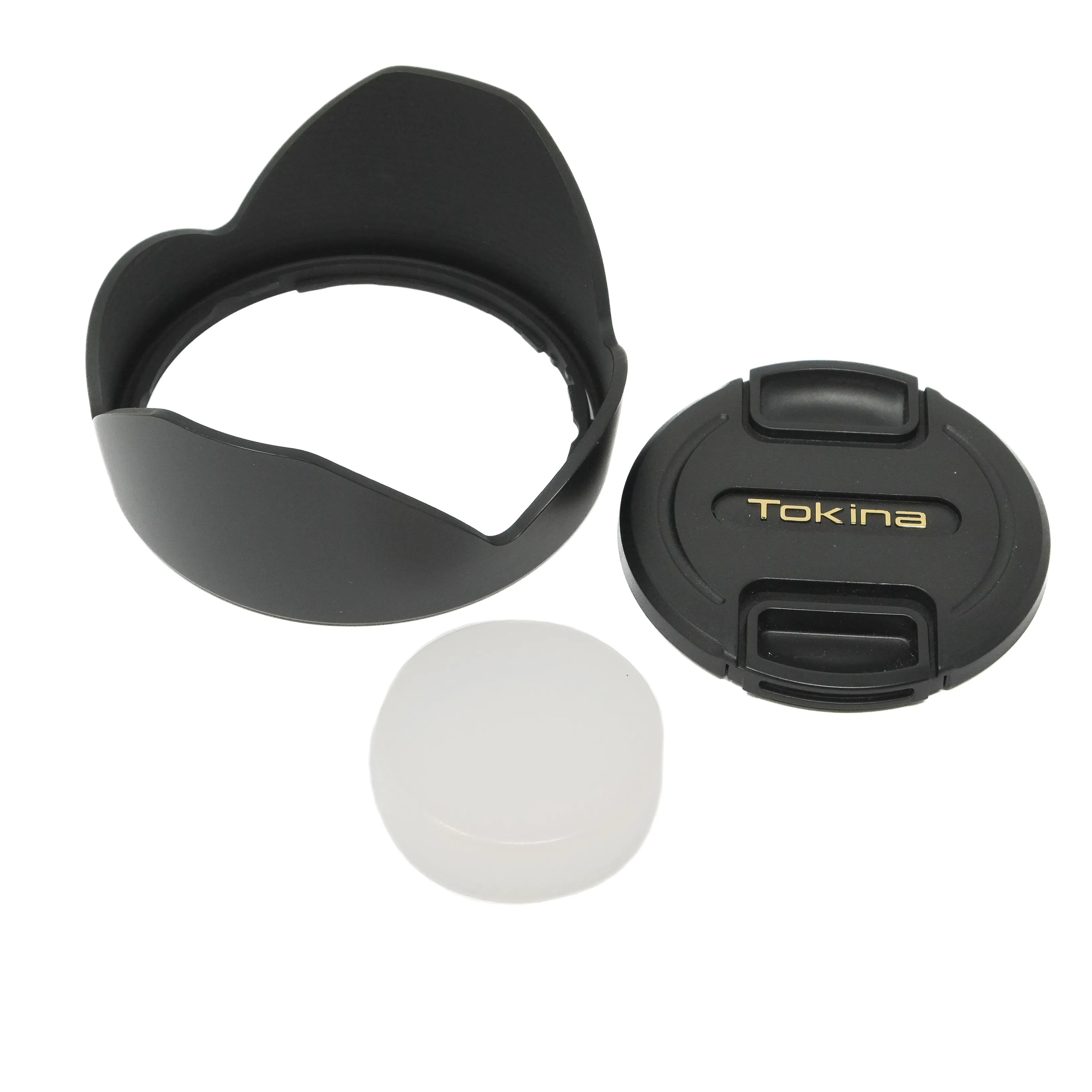 Camera lens hood and lens caps on a white background
